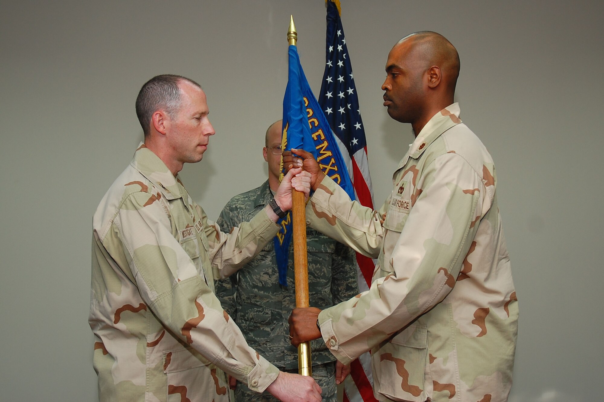 SOUTHWEST ASIA -- 386th Expeditionary Maintenance Squadron change of command.  Maj. Emille Bryant assumed command of the squadron from Maj. Konrad Cote here Sept. 24.  (U.S. Air Force photo by Staff Sgt. Tia Schroeder)