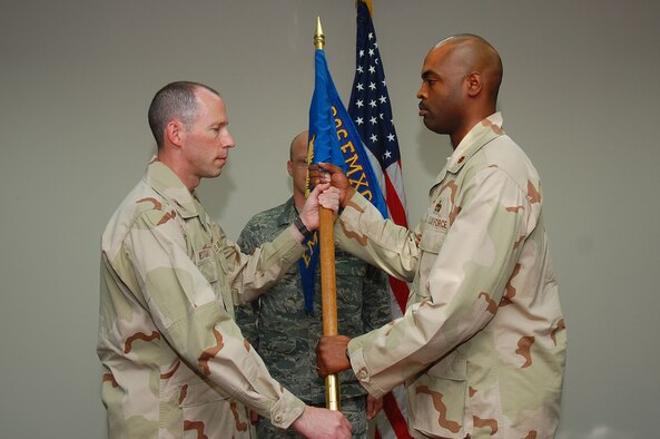 SOUTHWEST ASIA -- 386th Expeditionary Maintenance Squadron change of command.  Maj. Emille Bryant assumed command of the squadron from Maj. Konrad Cote here Sept. 24.  (U.S. Air Force photo by Staff Sgt. Tia Schroeder)