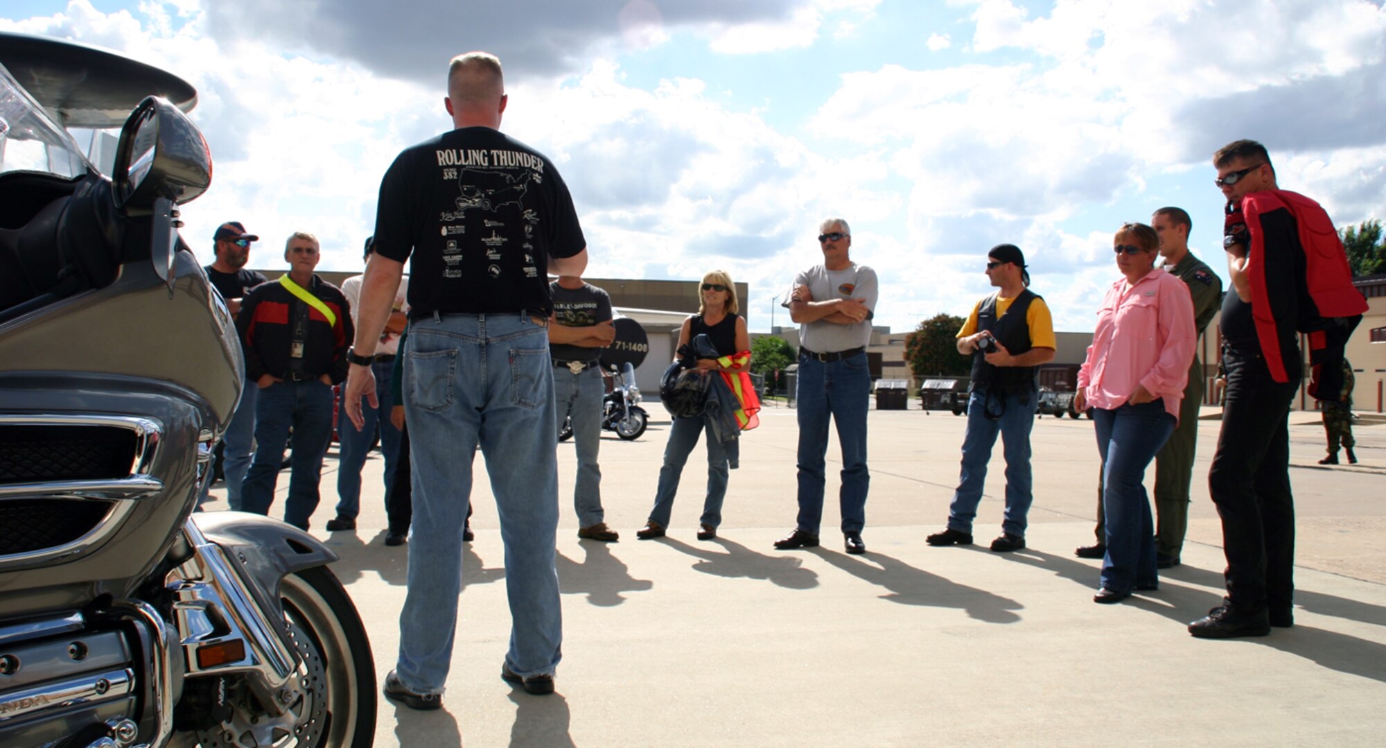 TINKER AIR FORCE BASE, Okla -- Master Sgt. Cary Beagle, Security Specialist Representative for the 552nd Air Control Wing, briefs the Tinker Riders and Mentors club before hitting the road for a group ride July 26. The Tinker Riders and Mentors program is designed to help newer riders transition from controlled courses to open roads and highways that can pose dangers for inexperienced motorcyclists and other motor vehicles. (Photo by Capt. Dejon Redd)