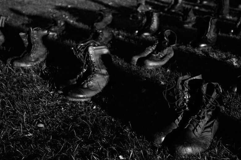 Several pairs of combat boots remain on display day and night to represent members either captured or lost as part of the Prisoner of War/Missing in Action 24-hour vigil during POW/MIA week, Sept. 20, 2007, at RAF Mildenhall. The boots were donated for last year's tribute and reused this year.
(U.S. Air Force photo by Tech. Sgt. Tracy L. DeMarco)
