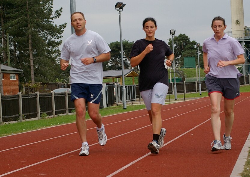 Maj. Stephen Hoffman, 100th Comptroller Squadron commander, 1st Lt. Kathy Ferrero, 100th Air Refueling Wing Public Affairs, and Karen Brown, also 100th ARW Public Affairs, run around the track near Heritage Park Sept. 14 as part of the Walk for Hope to help raise money for Women for Hope, for Afghan women. Women for Hope is a non-profit organization which raises money for Afghan women widowed through war on terror. (U.S. Air Force photo by Karen Abeyasekere)