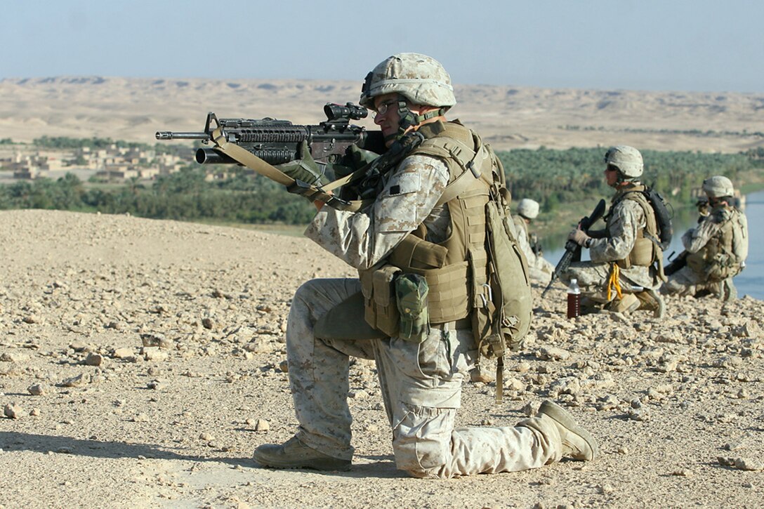 EXPEDITIONARY PATROL BASE - DULAB, Iraq, (Sept. 26, 2007) – Lance Cpl. Cameron J. Jensen, a team leader with Company A, 1st Battalion, 7th Marine Regiment, Regimental Combat Team 2, and the members of his team provide security for a vehicle checkpoint during Operation Bell Hurriyah. Bell Hurriyah, which means Enjoy Freedom, is battalion-wide operation directed at stopping the increase of insurgent activity during the Muslim holy month of Ramadan. Official Marine Corps Photo By Cpl. Ryan C. Heiser.