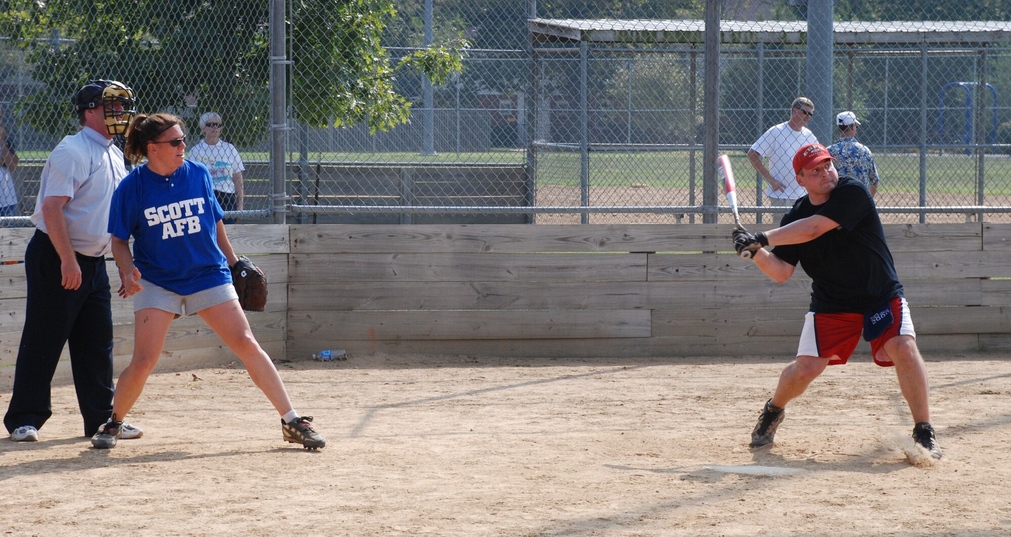 Hey there batter!  An officer of the 932nd Airlift Wing prepares to catch the first pitch at the recent softball match.