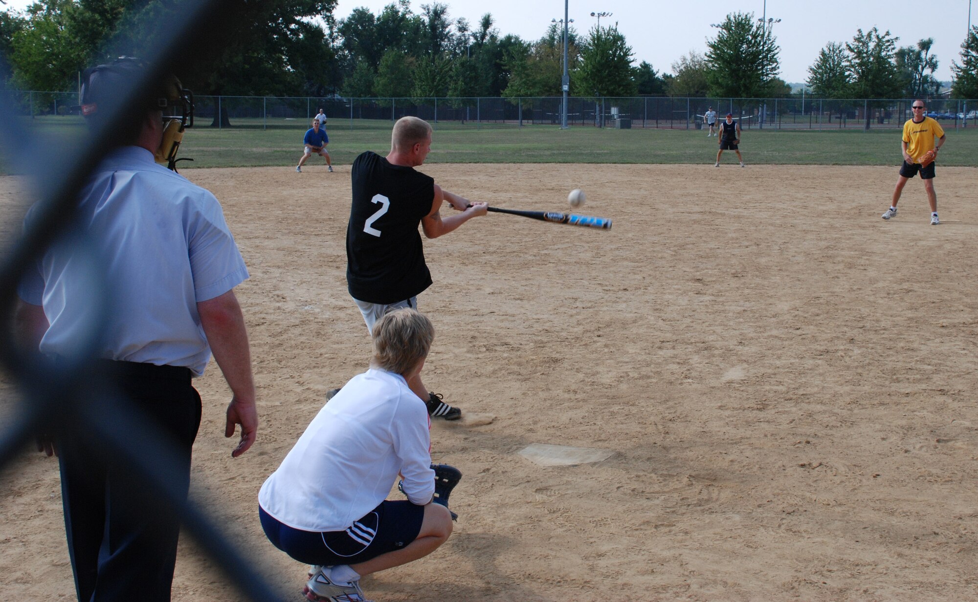 932nd says "Hey there batter!"  An officer of the 932nd Airlift Wing prepares to throw out the first pitch at the recent softball match.