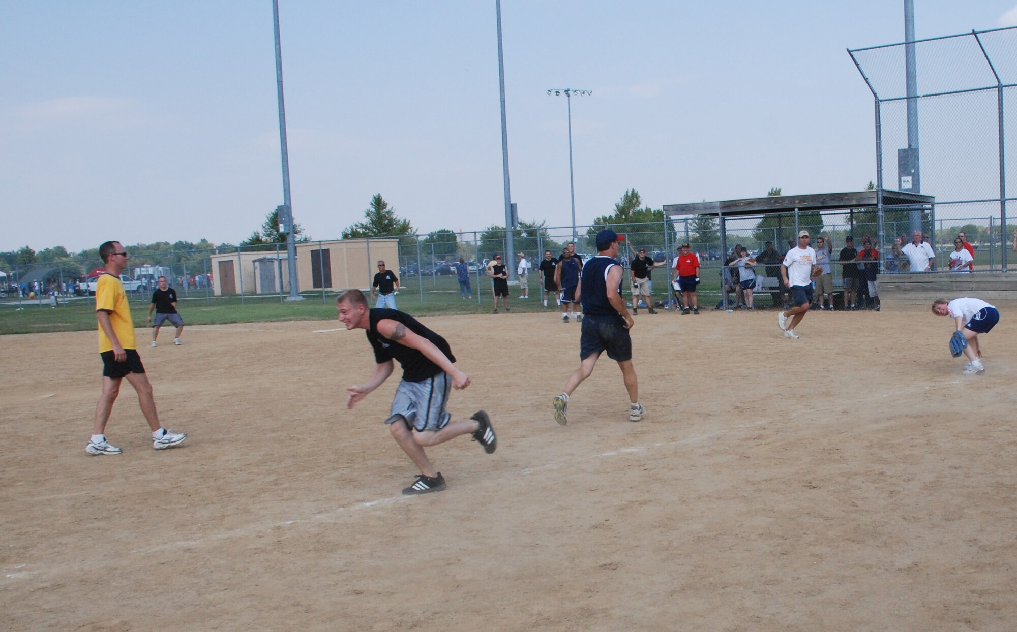 932ndHey there batter!  An officer of the 932nd Airlift Wing prepares to run back after the fpitch to home dring at the recent softball match.