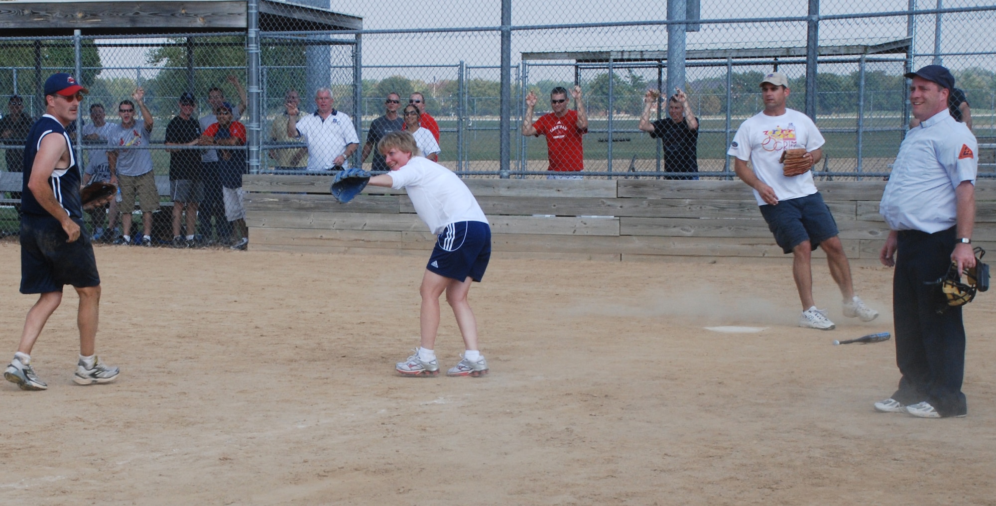 Hey there batter!  An officer of the 932nd Airlift Wing prepares to throw out the first pitch at the recent softball match.