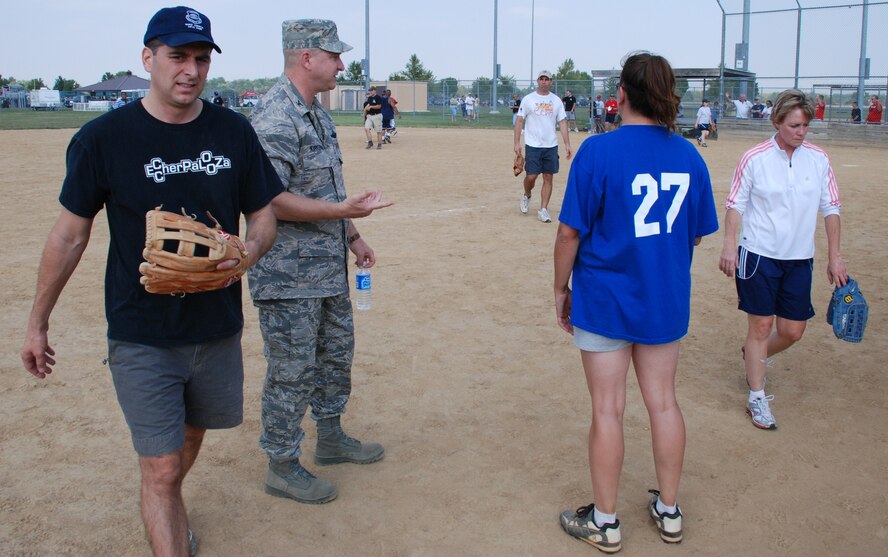 Hey there Airmen...get ready!  An officer of the 932nd Airlift Wing prepares Airmen to play at the recent softball match.