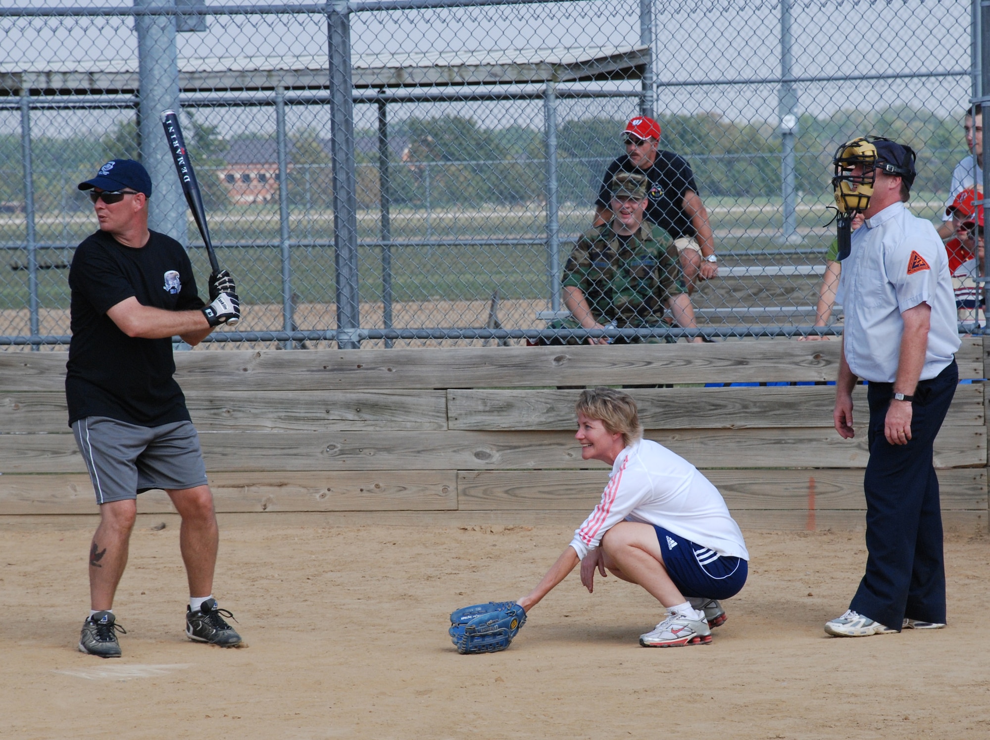 Hey there batter!  Enlisted and officers battled to a 10-10 tie at the recent softball match.