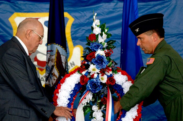 Retired Lt. Col. Robert Dunbar and Col. John Michel, 437th Airlift Wing vice commander, honor comrades who are missing in action and those who have been prisoners of war by placing a wreath on stage during a wreath ceremony Sept. 21 on Charleston AFB, S.C. (U.S. Air Force photo/Airman 1st Class Nicholas Pilch)