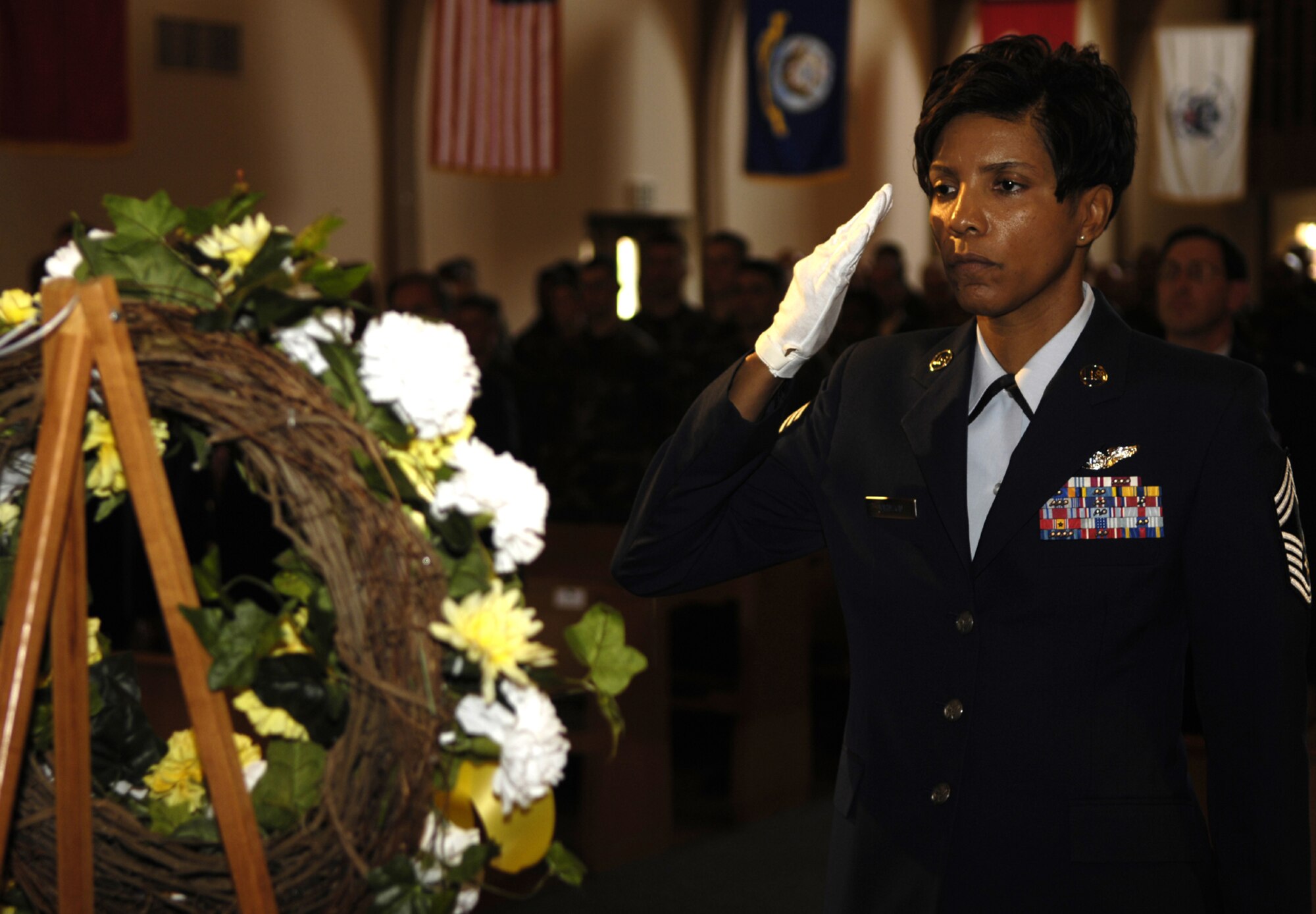 VANDENBERG AIR FORCE BASE, Calif.--Chief Master Sgt Cathy Johnson, 30th Medical Group, salutes a wreath during the POW/MIA Ceremony on Sep. 21. Vandenberg gathered for the remembrance ceremony to honor fallen Airmen, Soldiers, Seamen and Marines.(U.S. Air Force photo/Airman 1st Class Cole Presley)