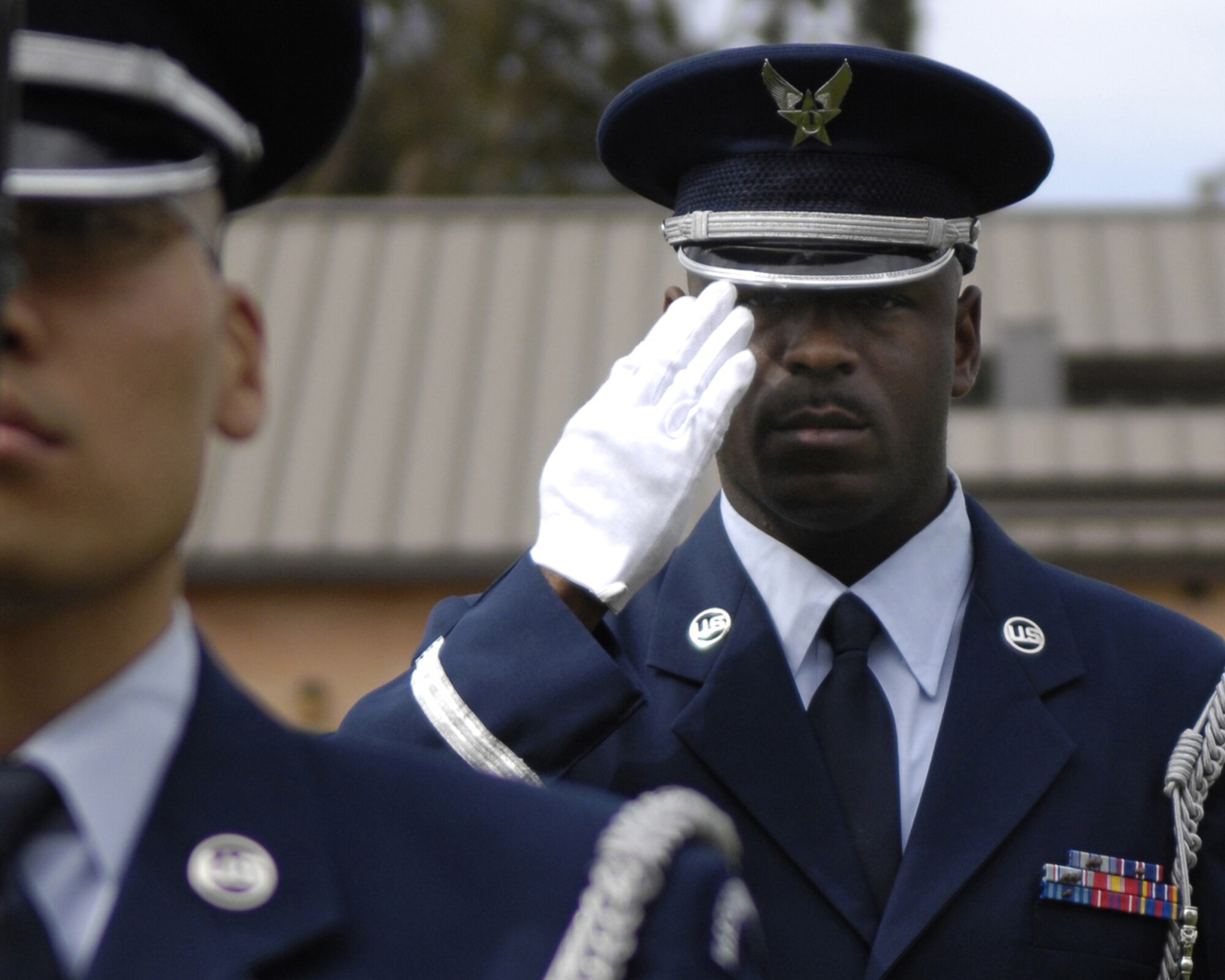 VANDENBERG AIR FORCE BASE, Calif. -- Staff Sgt. Najja Williams, a member of the Base Honor Guard, salutes during "Taps" at the POW/MIA Ceremony on September 21 at Vandenberg.  Vandenberg gathered for the remembrance ceremony to honor fallen Airmen, Soldiers, Seamen and Marines. (U.S. Air Force photo/Airman Jonathan Olds)
