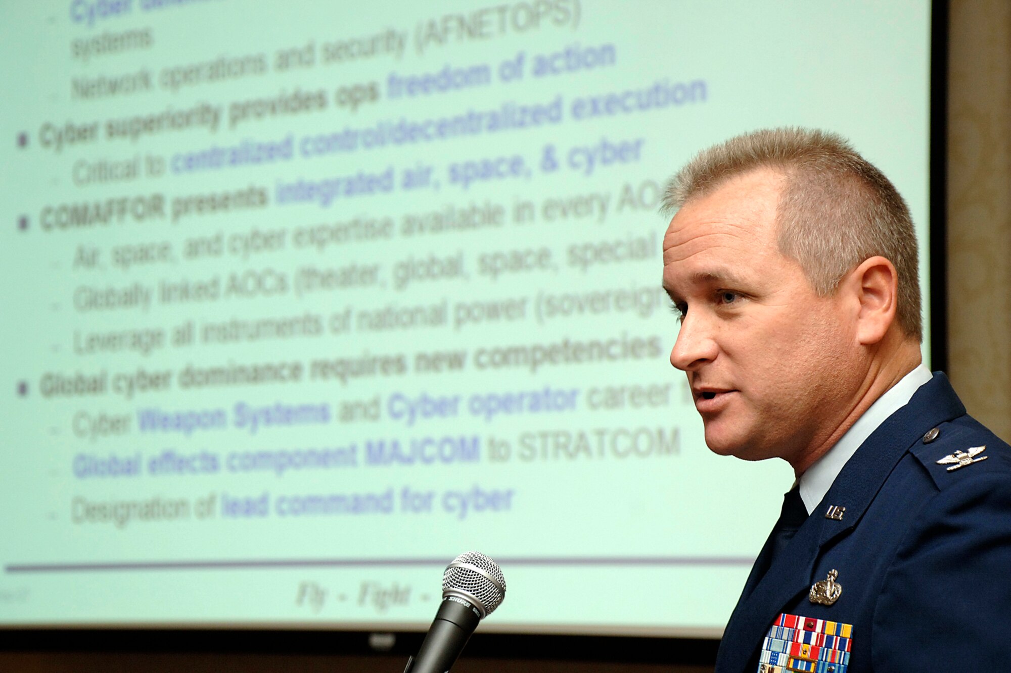 Col. Tony Buntyn, director of the Global Cyberspace Air Operations Center, 8th Air Force, Barksdale AFB, La., addresses the Fifth Annual Net-Centric Operations Conference Sept. 24 in New Castle, N.H.  The conference was sponsored by the Air Force Electronic Systems Center and the Association of Old Crows. (Air Force photo)

