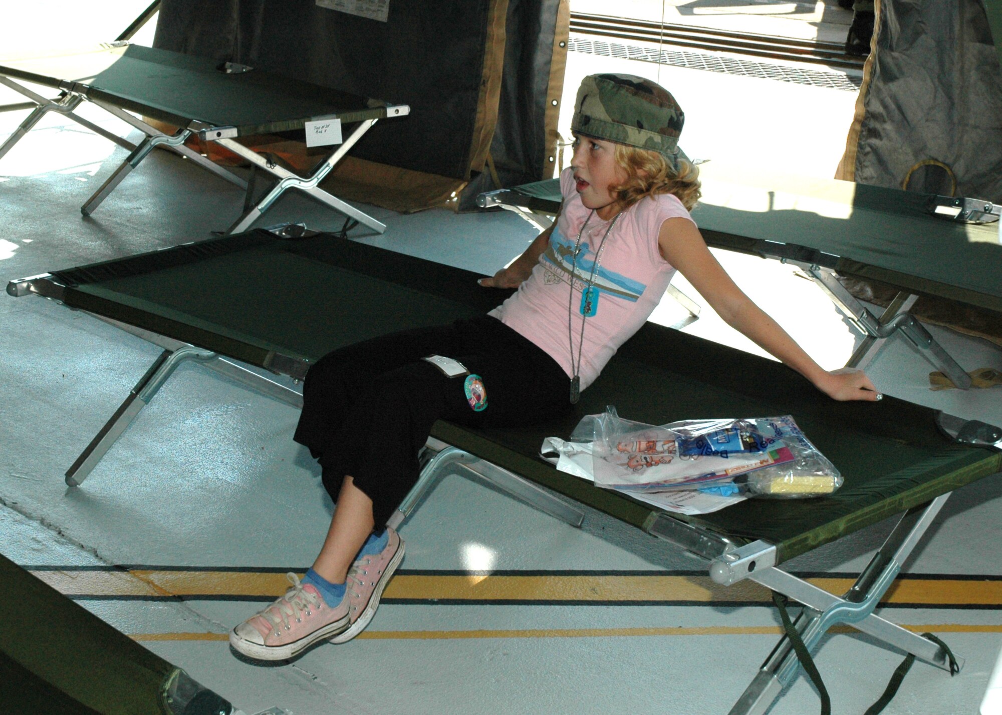 Jessi Pieper, age 10, takes a break during the Junior Deployment Line and Family AEF Fair Sept. 8, 2007 at Beale Air Force Base, Calif. The event introduced Air Force families to the deployment process, support programs and gave an idea of deployed life. Jessi is the daughter of Air Force Reservist Tech. Sgt. Laurie Pieper, a 940th Air Refueling Wing Family Support technician. (U.S. Air Force photo/Stacey Knott)