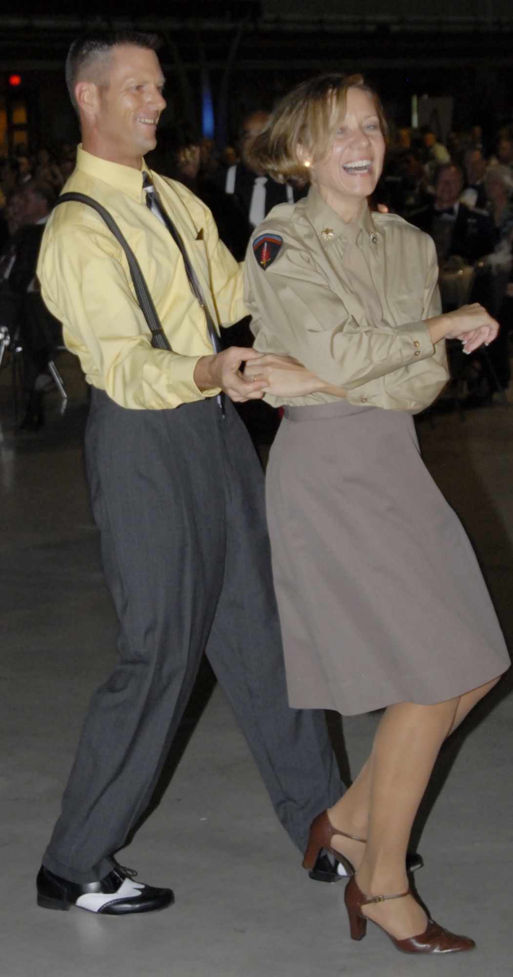 Maj. Michelle Kastler, chairperson of the Air Force Ball committee, and her husband, Randy, swing to music of the 1940s during Sheppard's celebration of the Air Force's 60th Anniversary Sept. 22. Several Team Sheppard members spent weeks preparing for the era's popular style of dancing to provide entertainment for Airmen and guests at the ball. (U.S. Air Force photo/Sandy Wassenmiller)