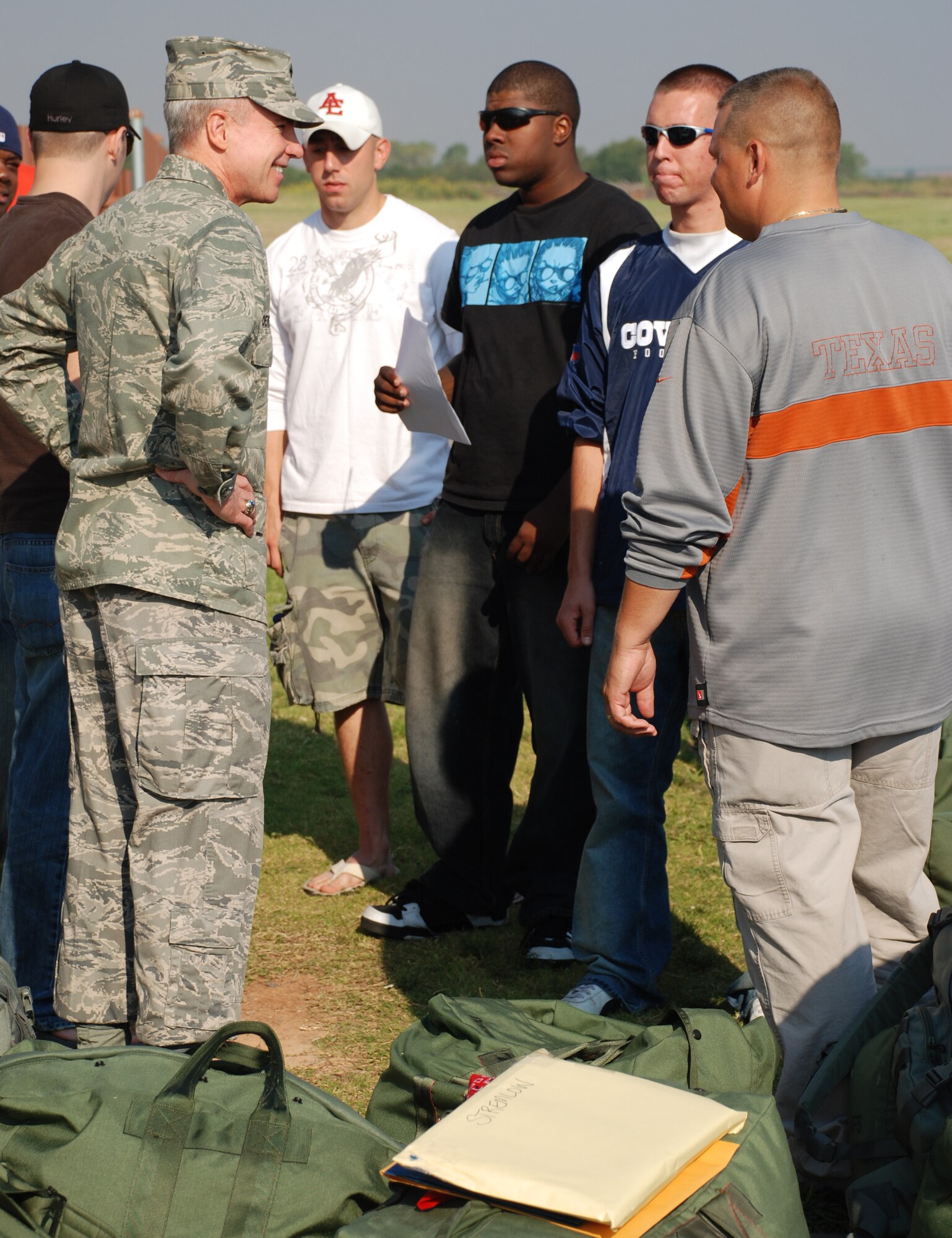 Brig. Gen. Richard Devereaux, 82nd Training Wing commander, chats with 82nd Security Forces Squadron members Sept. 23 before they leave Sheppard for a deployment. A 13-man team will train at Fort Lewis, Wash., for a couple months before heading over seas. (U.S. Air Force photo/John Ingle)