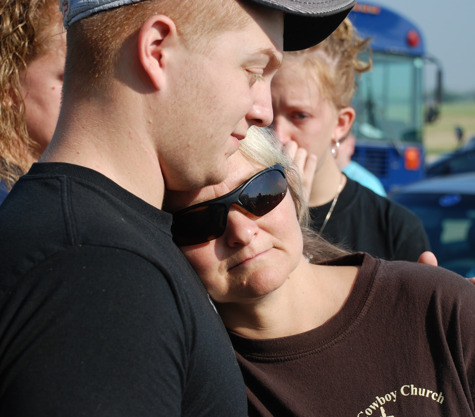 Airman 1st Class Jeff Irwin comforts him mother, Diane Barber, Sept. 23 before departing Sheppard on a deployment. Airman Irwin and 12 others from the 82nd Security Forces Squadron left Sheppard for additional training with the Army before heading overseas. (U.S. Air Force photo/John Ingle)