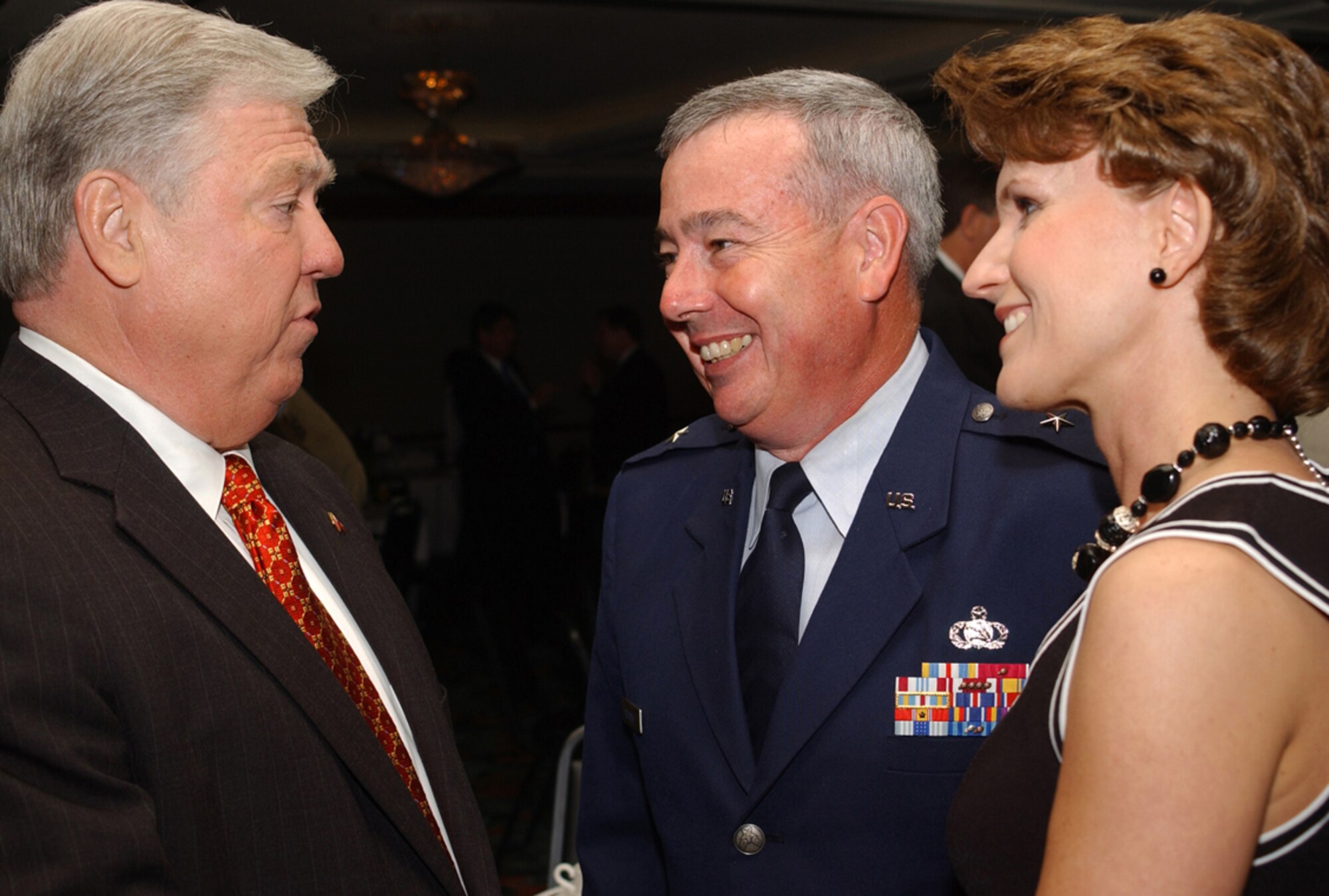 Left, Gov. Haley Barbour chats with Brig. Gen. Paul Capasso and his wife, Laura, March 23 after the general was named one of South Mississippi Outstanding Commu-nity Leaders for 2006.  In May, the Capassos were recognized for their leadership with the Air Force’s Gen. and Mrs. Jerome F. O’Malley Award.  (U.S. Air Force photo by Tech. Sgt. Chuck Marsh)
