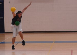 LANGLEY AIR FORCE BASE, Va. -- George Sherman gets tagged with a ball while trying to defend the 1st Operations Support Squadron’s dodgeball team, during the tournament at the Shellbank Fitness Center Sept 21. The 1st Operations Group took the title, with the 1st Civil Engineer Squadron placing second and the 1st Logistics Readiness Squadron and 1st Component Maintenance Squadron combined team taking third. (U.S. Air Force photo/Senior Airman Christopher L. Ingersoll)