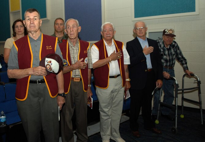 Former prisoners of war place a hand over their hearts during the playing of the National Anthem at the POW/MIA Recognition Day at Nellis AFB, Nev., Sept. 21, 2007. (US Air Force photo by Airman Stephanie Rubi)