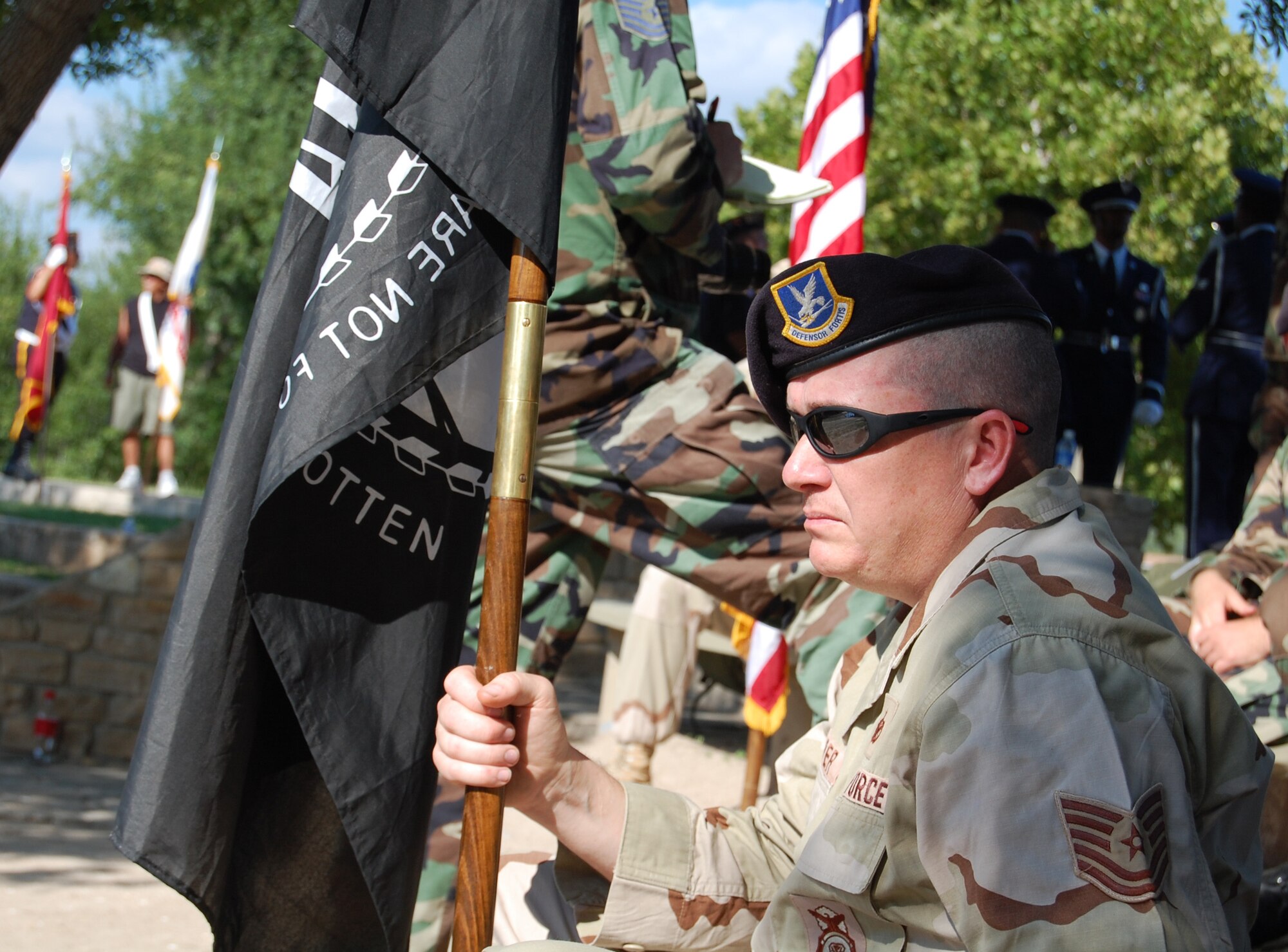 LAUGHLIN AIR FORCE BASE, Texas – Tech Sgt. Thomas Cooper, 47th Security Forces Squadron, awaits the beginning of the National POW/MIA Recognition ceremony in the Dr. Alfredo Gutierrez Jr. Amphitheatre, Del Rio, Texas, after a taxing 7 mile walk Sept. 21. (U.S. Air Force photo by Airman Sara Csurilla)