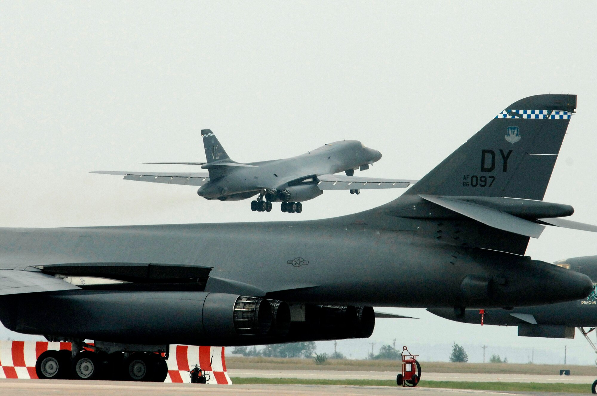 A B-1B Lancer from Dyess Air Force Base, Texas, takes off from Ellsworth AFB, S.D., Sept. 17. Ellsworth AFB is temporarily housing 20 of the B-1B aircraft during the repair of 6,600 feet of runway at Dyess AFB. Approximately 550 Dyess AFB Airmen are also temporaily based at Ellsworth AFB. (U.S. Air Force photo/Staff Sgt. Michael Keller) 