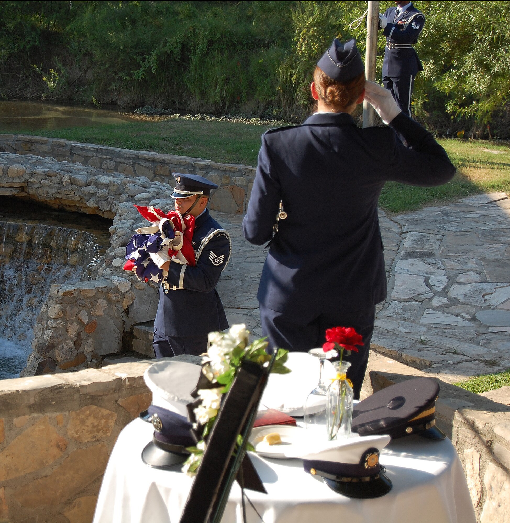 LAUGHLIN AIR FORCE BASE, Texas – Staff. Sgt. Arturo Castro, 47th Contracting Squadron and Laughlin Honor Guard member, slowly walks the American flag away as they retire the colors during the National POW/MIA Recognition ceremony in Del Rio, Texas, Sept. 21. (U.S. Air Force photo by Airman Sara Csurilla)