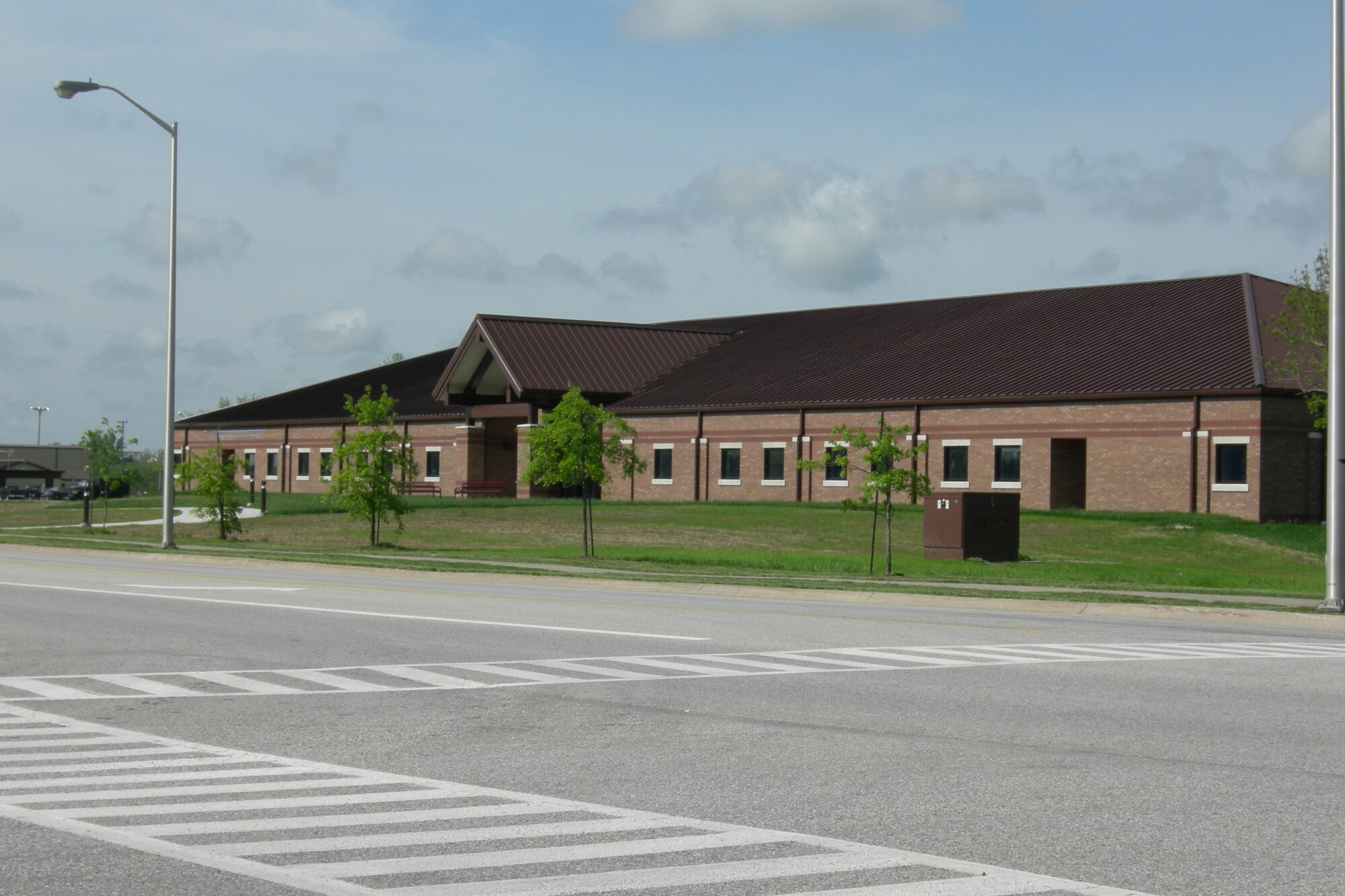 The crosswalk in front of the Whiteman Professional Development Center is an example for pedestrians and vehicle operators to work together to keep each other safe. Pedestrians should wait until approaching vehicles come to a complete stop before proceeding into the roadway. When pedestrians are using crosswalks, vehicle operators will stop a safe distance from the crosswalk and yield the right of way. (Photo printed with permission of Tech. Sgt. Raul Betancourt)
