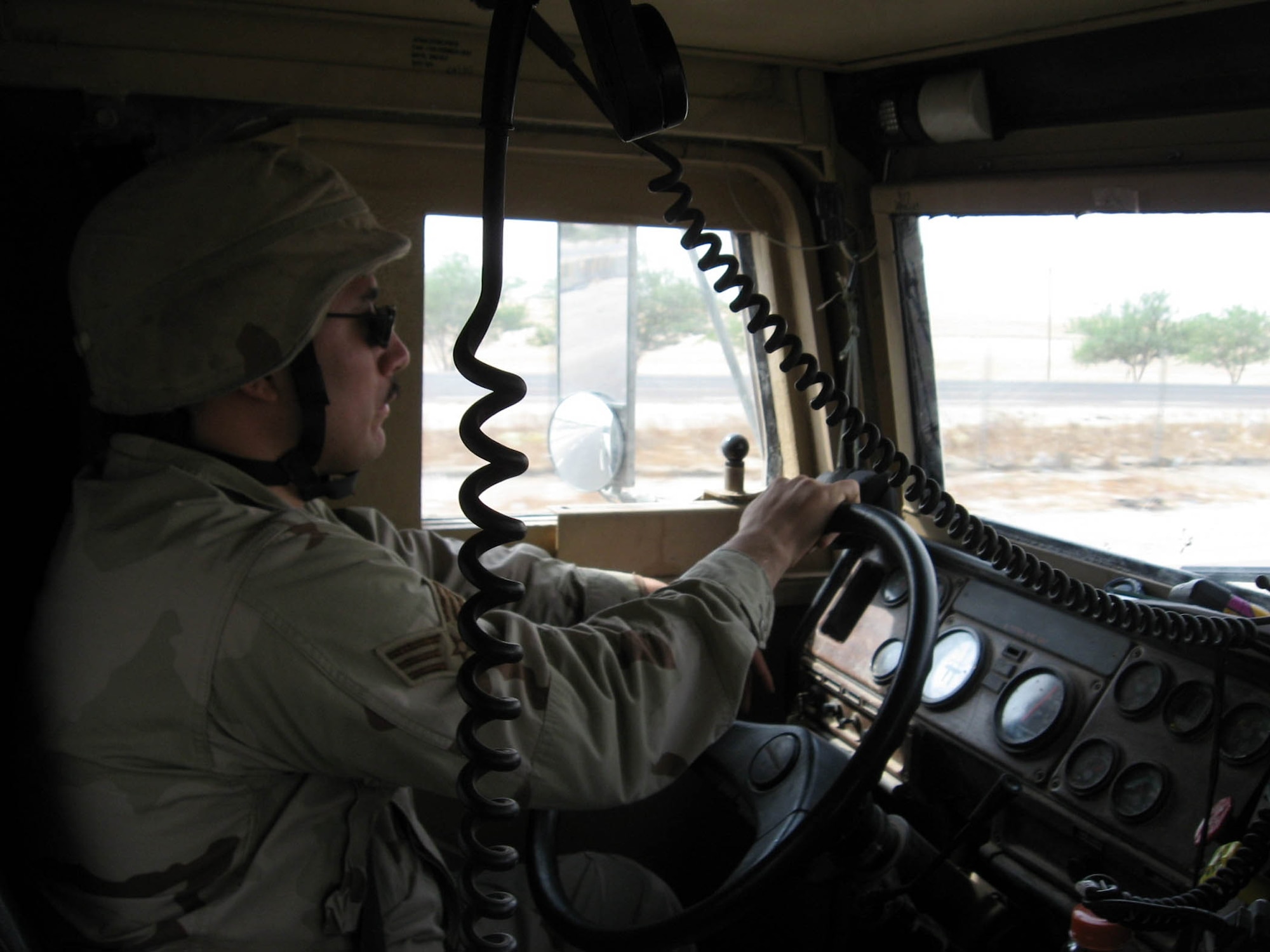 A member of an Air Force Medium Truck Detachment drives during a convoy mission. During a 210-day period, these Airmen complete more than 180 convoys, put 2.5 million convoy miles on the road and encounter more than 40 improvised explosive devices and small arms fire. (U.S Air Force photo)