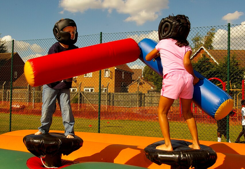 Jakob Madura, left, and Rebecca Abeyasekere, both 6, battle it out at the Day for Kids Sept. 15 at the RAF Mildenhall Youth Center. (U.S. Air Force photo by Karen Abeyasekere)
