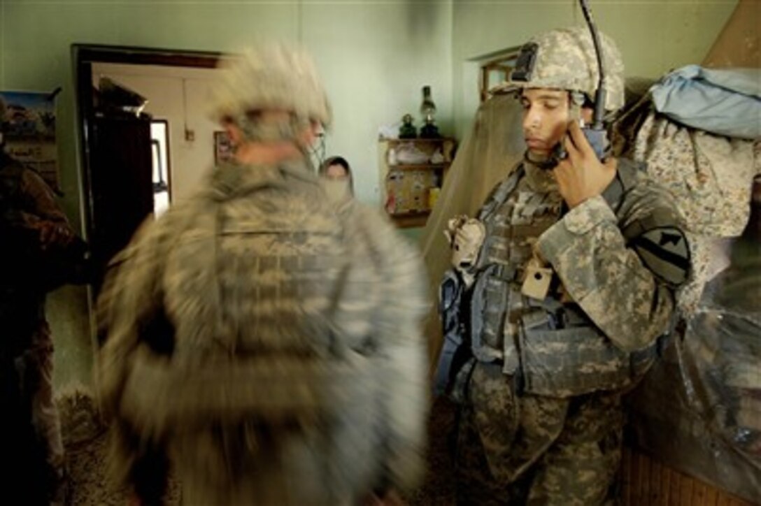 U.S. Army soldiers from Charlie Company, 6th Squadron, 9th Cavalry Regiment, 3rd Brigade Combat Team, 1st Cavalry Division search a house during a patrol in Muqadiyah, Iraq, on Sept. 21, 2007.  