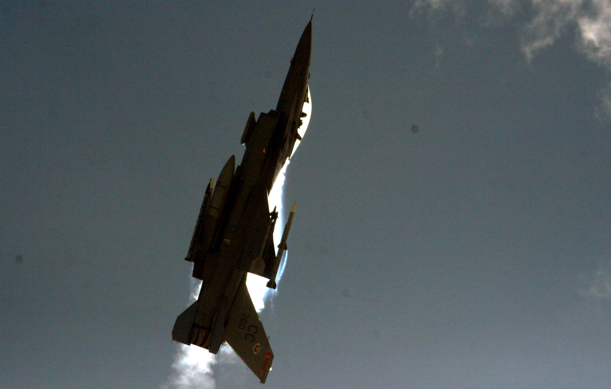 This F-16 demonstrates its great range of maneuverability here during aerial intercept exercises. While the air-to-ground combat role is extremely important in the continuing Global War on Terror, the Air Force must maintain the capability to adapt to any threat to the United States or her allies. The F-16 C/D model is capable of withstanding up to nine G’s, which is nine times the force of gravity, during combat maneuvers. This capability exceeds that of other fighter aircraft in the world and keeps the F-16 at the forefront of fighter aircraft superiority. (Air Force Photo/Senior Master Sgt. Mahmoud Rasouliyan)