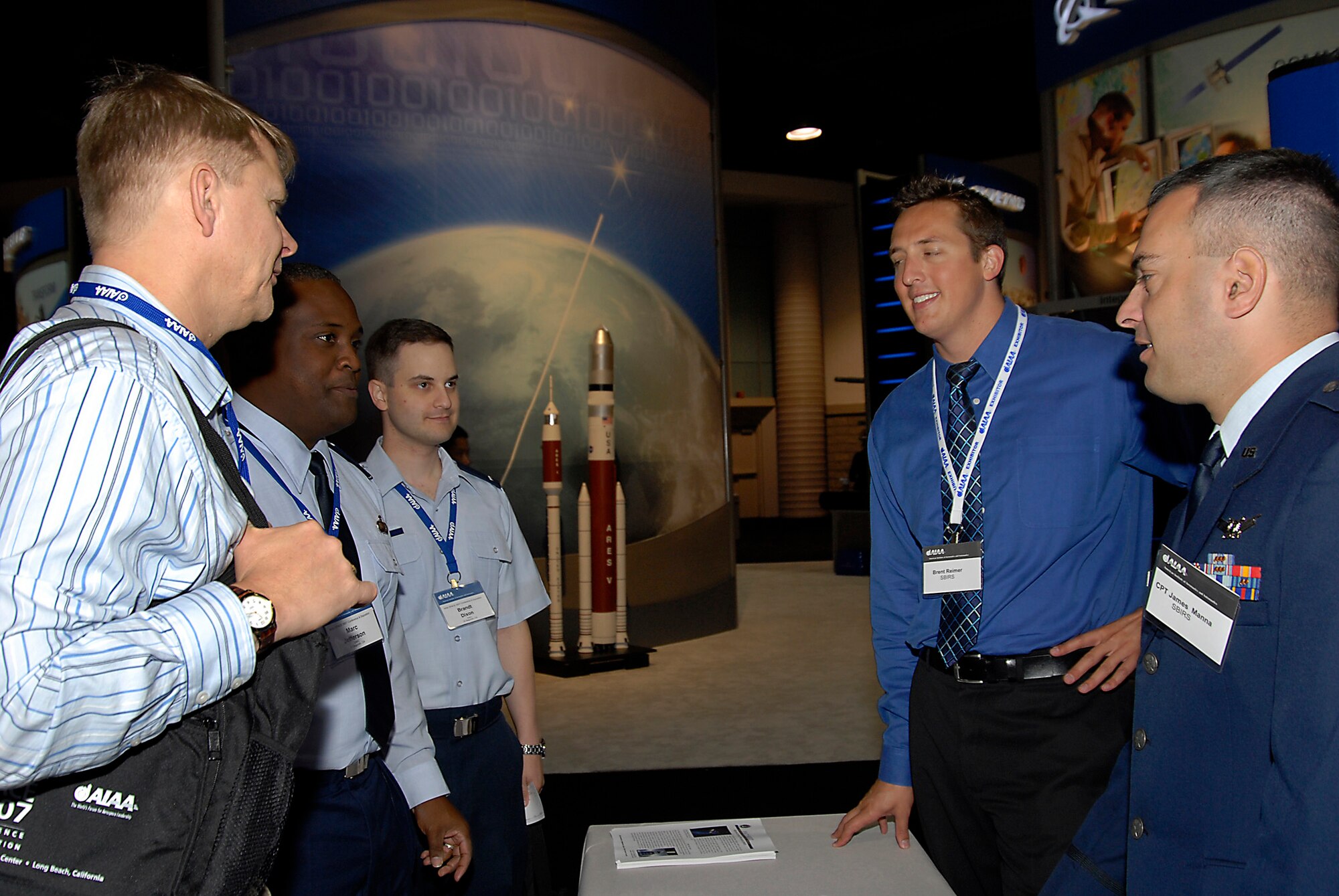 Capt. James Manna and Brent Reimer, both from the SBIRS Wing, talked to students and teachers about SMC programs and space in Education Alley. Part of AIAA’s Space 2007 Conference, Education Alley provided local school students with an opportunity to learn more about space and space careers. (Photo by Joe Juarez)