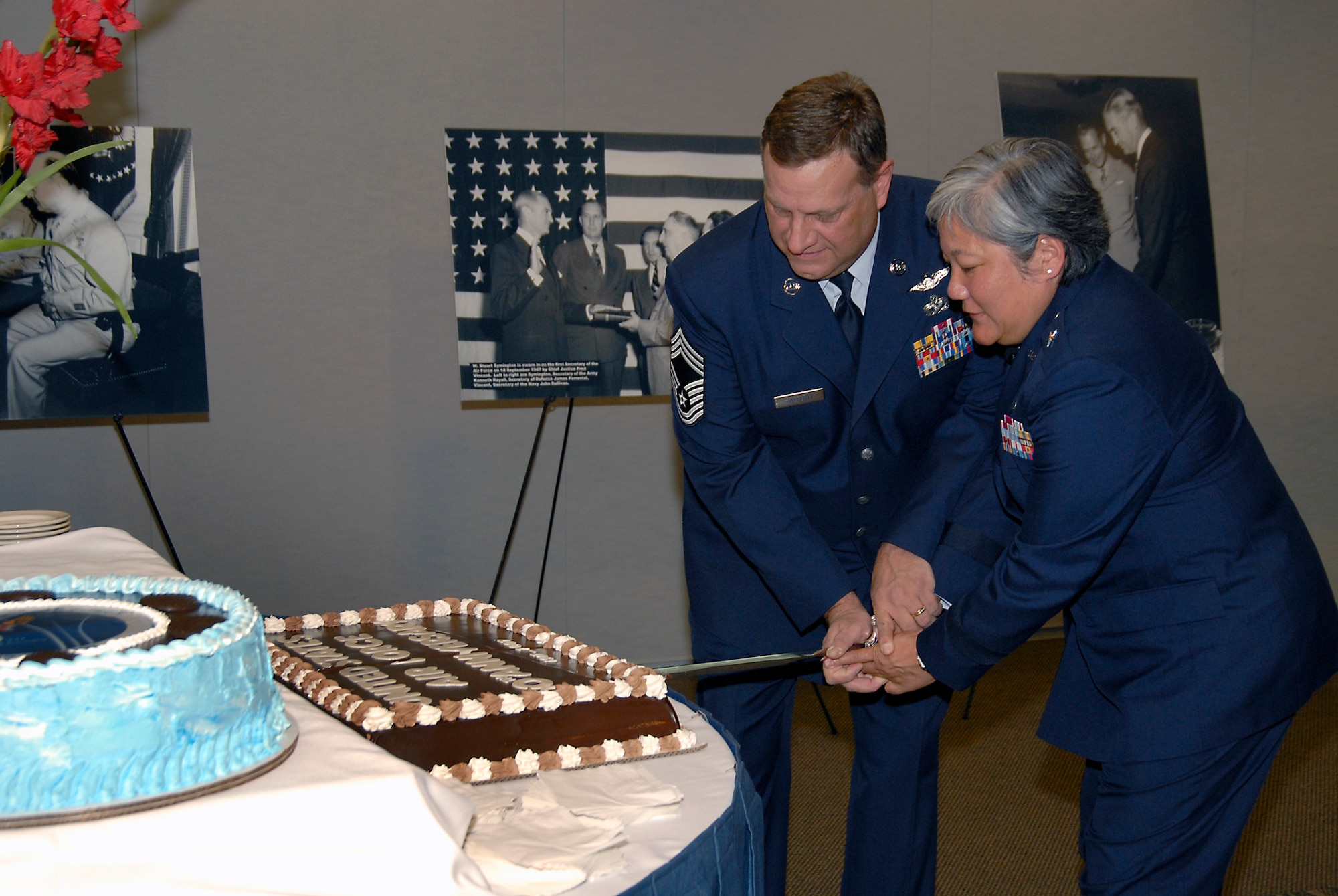 Brig. Gen. Susan Mashiko, MILSATCOM Wing Commander, and Chief Master Sgt. Mark Rafferty cut a birthday cake at Los Angeles AFB’s celebration in honor of the Air Force’s 60th Anniversary, Sept. 18. The celebration was held in the Gordon Conference Center. (Photo by Joe Juarez)
