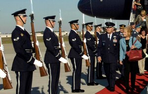 General William T. Hobbins, Commander U.S. Air Forces Europe and his wife Robbin walk down a red carpet lines with Honor Guard members presenting arms Sept. 21. General Hobbins visited from Europe to attend the Global Air Chiefs conference.