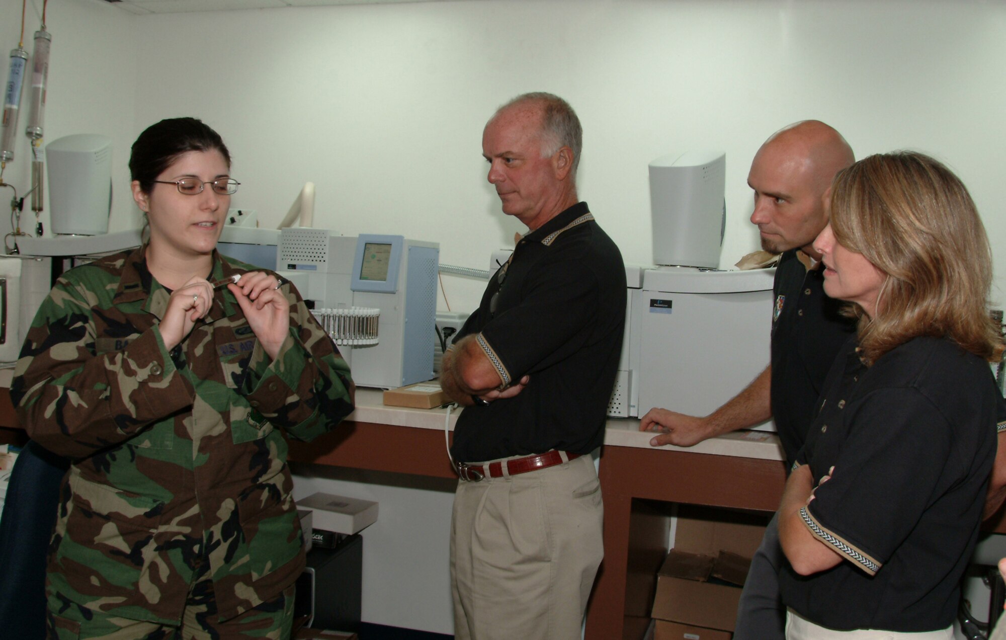 EGLIN AIR FORCE BASE, Fla. -- 1st Lt. Stacy Baber, 28th Test and Evaluation Squadron Agile Combat Support Division Chief, shows the 53d Wing Honorary Commanders what a sorbent tube is and how it's used to determine a system's Chemical, Biological, Radiological and Nuclear protection factor, during a 53d Wing tour. Honorary comanders in the pahoto are Wayne Hoar, 85th Test and Evalulation Squadron, Matthew Avery, 16th Electronic Warfare Squadron, and Jeanne Dailey, 68th EWS. (U.S. Air Force photo/TSgt. Andrew Leonhard)