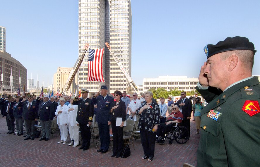HANSCOM AFB, Mass. -- Maj. Jack McKenna, Massachusetts National Guard, renders a salute during a ceremony in Boston Sept. 21 held in honor of prisoners of war and servicemembers missing in action. The event was attended by Col. Tom Schluckebier, 66th Air Base Wing commander, as well as the Air Force Band of Liberty and many Airmen from Hanscom. (U.S. Air Force photo by Jan Abate)