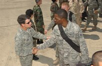 Brig. Gen. Darrell Jones, a former 37th Training Wing commander, says goodbye Sept. 13, 2007, to Senior Airman Brock Elton, 37th Civil Engineer Squadron. Lackland Air Force Base Airmen from Wilford Hall Medical Center, the 37th Training Wing and the Air Force Intelligence, Surveillance and Reconnaissance Agency left for deployments overseas for four to six months. (USAF photo by Alan Boedeker)