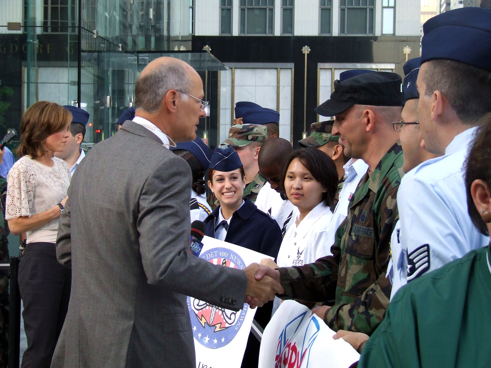 Anchor Harry Smith from CBS' "The Early Show," shakes hands with Tech. Sgt. Scott Sturkol from the Air Force Expeditionary Center at Fort Dix, N.J., during filming of the show Sept. 26 in New York. Along with Sergeant Sturkol, Airmen from McGuire Air Force Base, N.J., and cadets and cadre from Manhattan College's ROTC Det. 560 participated in the event observing the 60th anniversary of the Air Force. (U.S. Air Force Photo/Tech. Sgt. Rebecca Danet) 

