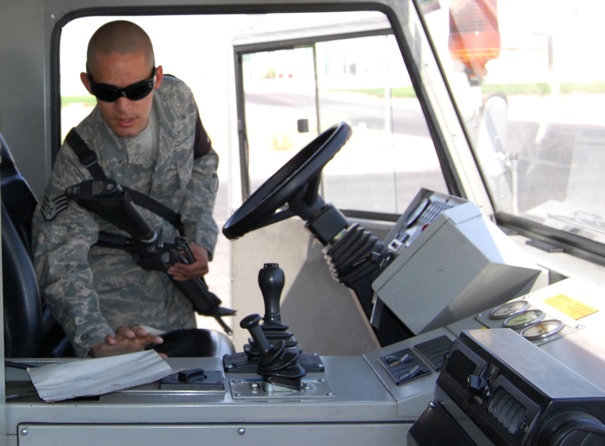Staff Sgt. Ismael Nava finds a sheet of paper which may contain sensitive information Sept. 25 at an undisclosed location. Sergeant Nava is a 387th Expeditionary Support Squadron force protection specialist from F.E. Warren Air Force Base, Wy. (U.S. Air Force photo/Staff Sgt. Phillip Butterfield)