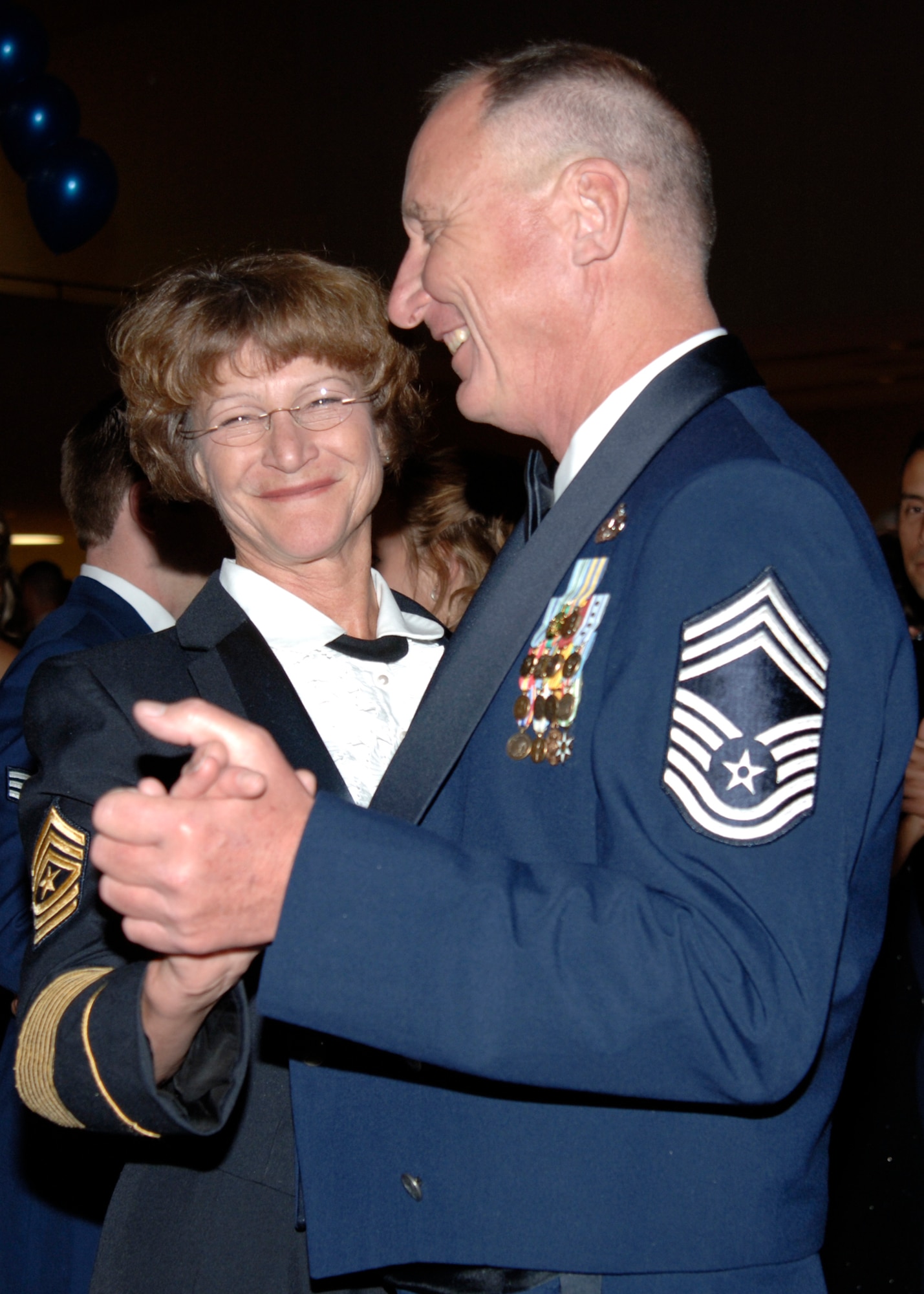 MCCONNELL AIR FORCE BASE, Kan. -- Chief Master Sgt. Jonathan Lough, 931st Reserve Civil Engineer Squadron, and his wife Sgt. Maj. Dianna Klamt, Army reservist with the Joint Chiefs of Staff, Wash. D.C., dance to a live band performing at the 60th Anniversary Air Force Ball, Sept. 15, at the Century II Convention center, Wichita. (photo by Airman 1st  Class Justin Shelton)