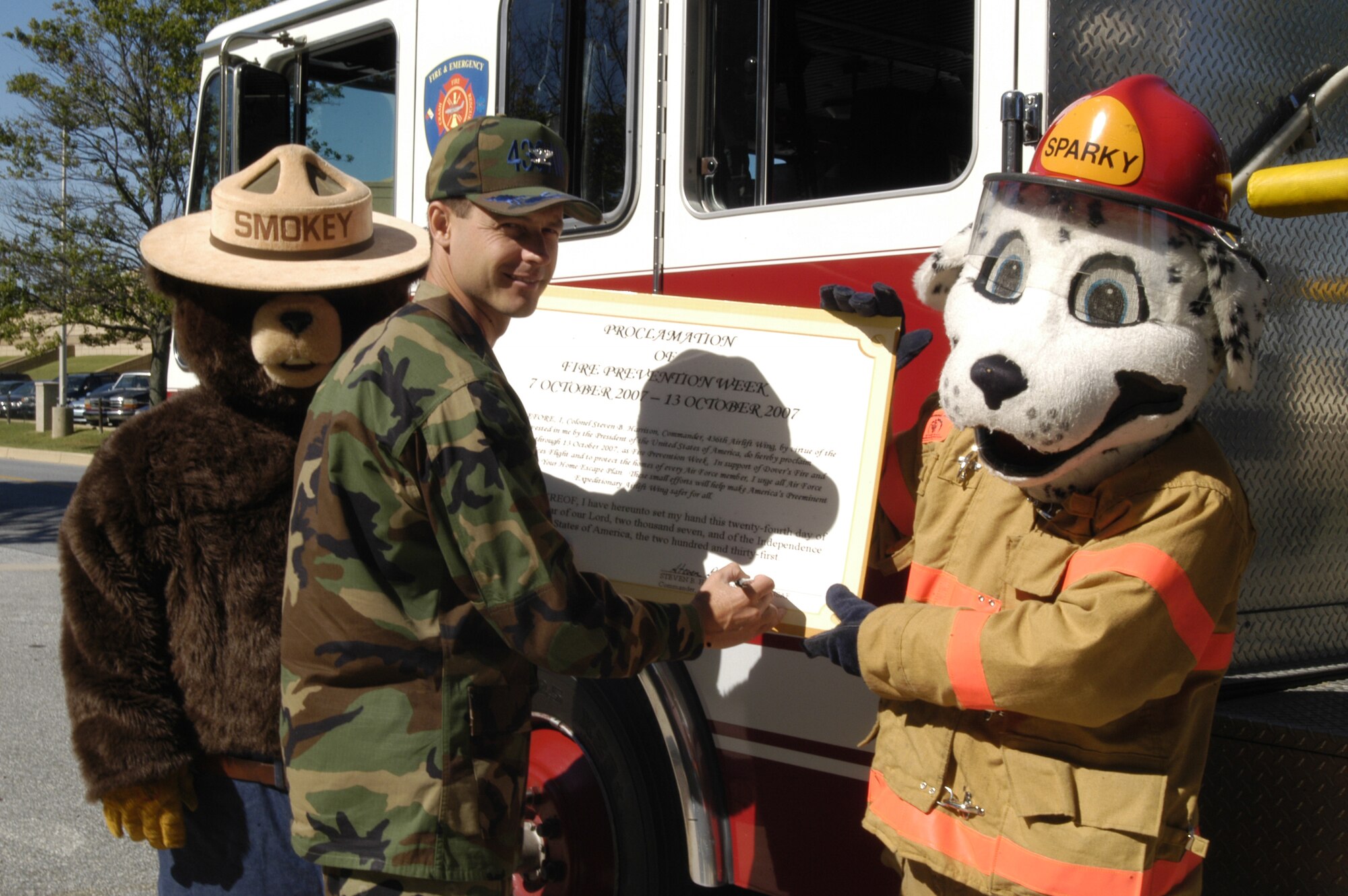 Col. Steven Harrison, 436th  Airlift Wing commander signs the proclamation for Fire Prevention Week. This year's theme is 'practice your home escape.' Fire Prevention Week runs Oct. 7 through 13. (U.S. Air Force photo/Airman Shen-Chia Chu)