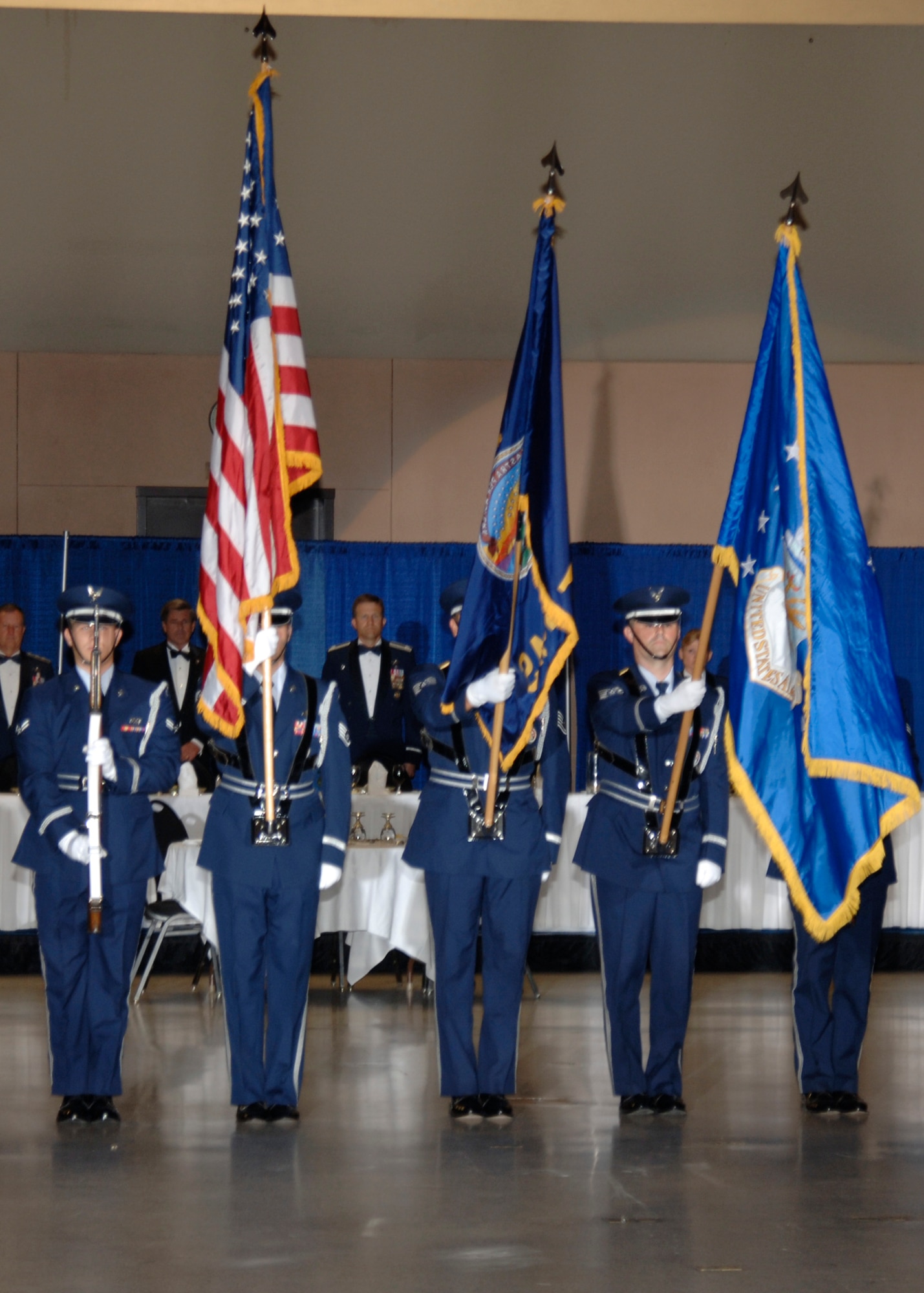 MCCONNELL AIR FORCE BASE, Kan. -- The base Honor Guard team hoists the colors for the singing of the National Anthem at the 60th Anniversary Air Force Ball, Sept. 15. at the Century II Convention center, Wichita. (photo by Airman 1st Class Justin Shelton)