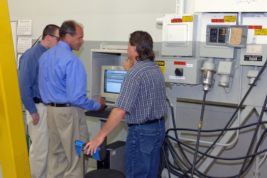HILL AIR FORCE BASE, Utah-- (From left to right) Trent Ray, Don Cazel, executive director for the Ogden Air Logistics Center, and Troy Tingey, Hill's union president, highlight one of Hill AFB's new kiosks located in high-traffic areas for wage grade employees' use for work-related access. (U.S. Air Force photo by Alex R. Lloyd)