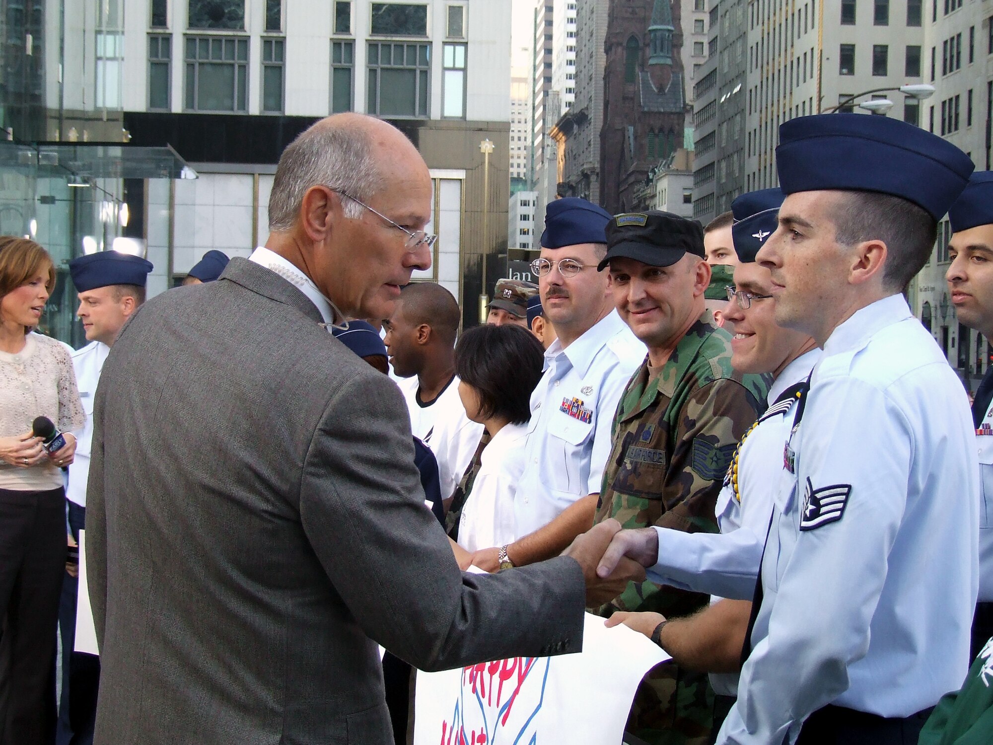 Anchor Harry Smith from CBS' The Early Show greets Airmen from McGuire Air Force Base and the U.S. Air Force Expeditionary Center at Fort Dix, N.J., along with cadets and cadre from Det. 560 of the Reserve Officer Training Corps at Manhattan College during fiming for the show Sept. 26, 2007, in New York City.  Approximately 30 Airmen and cadets participated in the event observing the 60th anniversary of the Air Force.  (U.S. Air Force Photo/Tech. Sgt. Rebecca Danet)