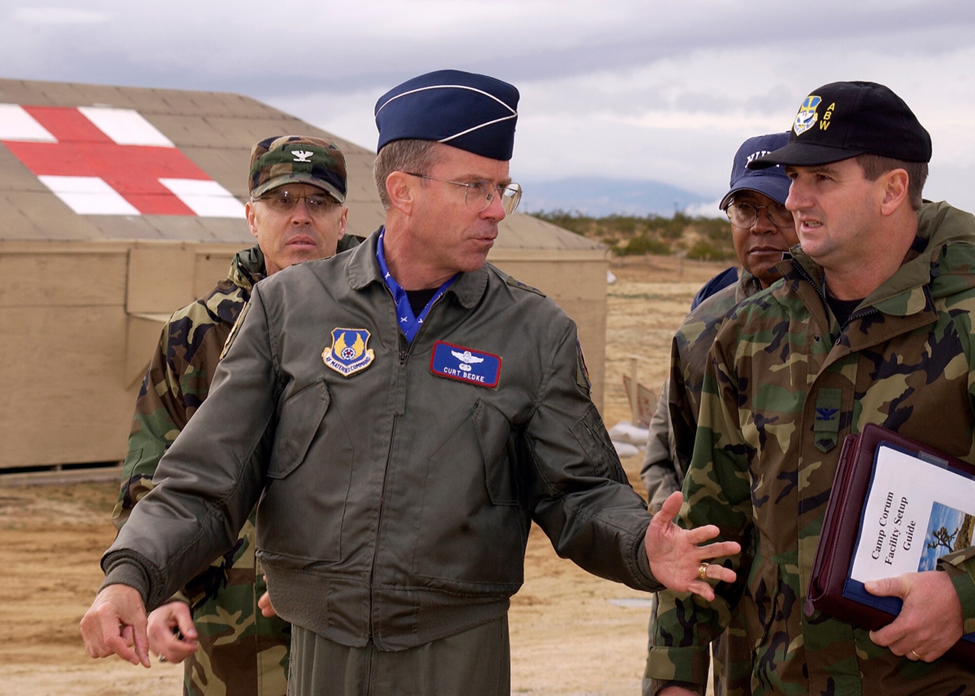 Maj. Gen. Curtis Bedke, Air Force Flight Test Center commander, talks to Col. H. Brent Baker Sr., former 95th Air Base Wing commander, at Camp Corum on Dec. 2, 2005. General Bedke will relinquish command of the AFFTC to Brig. Gen. David Eichhorn on Wednesday. (Courtesy photo)