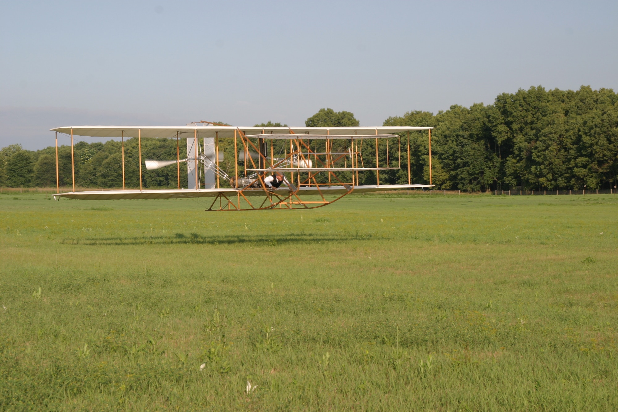 Vintage aircraft builder Mark Dusenberry pilots a replica Wright Flyer III at Huffman Prairie Flying Field.  Dusenberry will reenact the first practical circling flight by a powered aircraft during a National Park Service and Aviation Heritage Foundation sponsored event at Wright-Patterson Air Force Base on Oct. 5. (National Park Service photo)