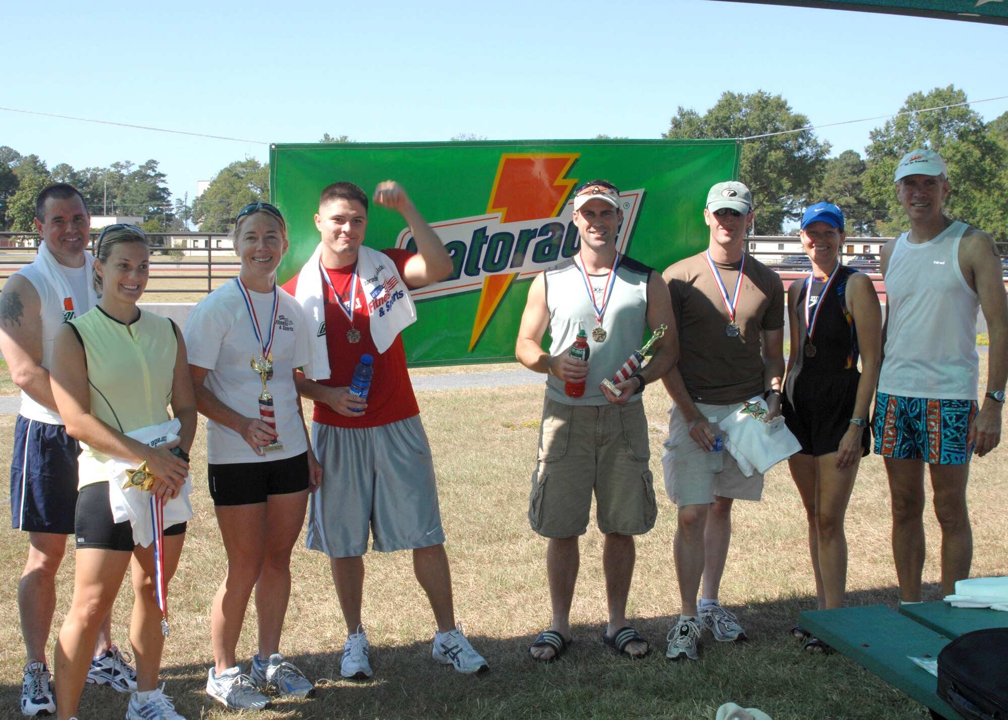 SEYMOUR JOHNSON AIR FORCE BASE, N.C. - MSgt William Johnson, Frank Werner, Andy Ladd, Capt Chris Varani, Airman 1st Class Theodore Reynolds, Diane Giefer, Capt Jennifer Geiovannetti, and Karla Werner all participants in this years Gatorade sponsored Triathlon.  The race, which consisted of lapping swimming, a 15 mile bike ride and a 4 mile run was hosted by the 4th Services Squadron September, 8 2007.  The (U.S. Air Force photo by Senior Airman Chad Trujillo)