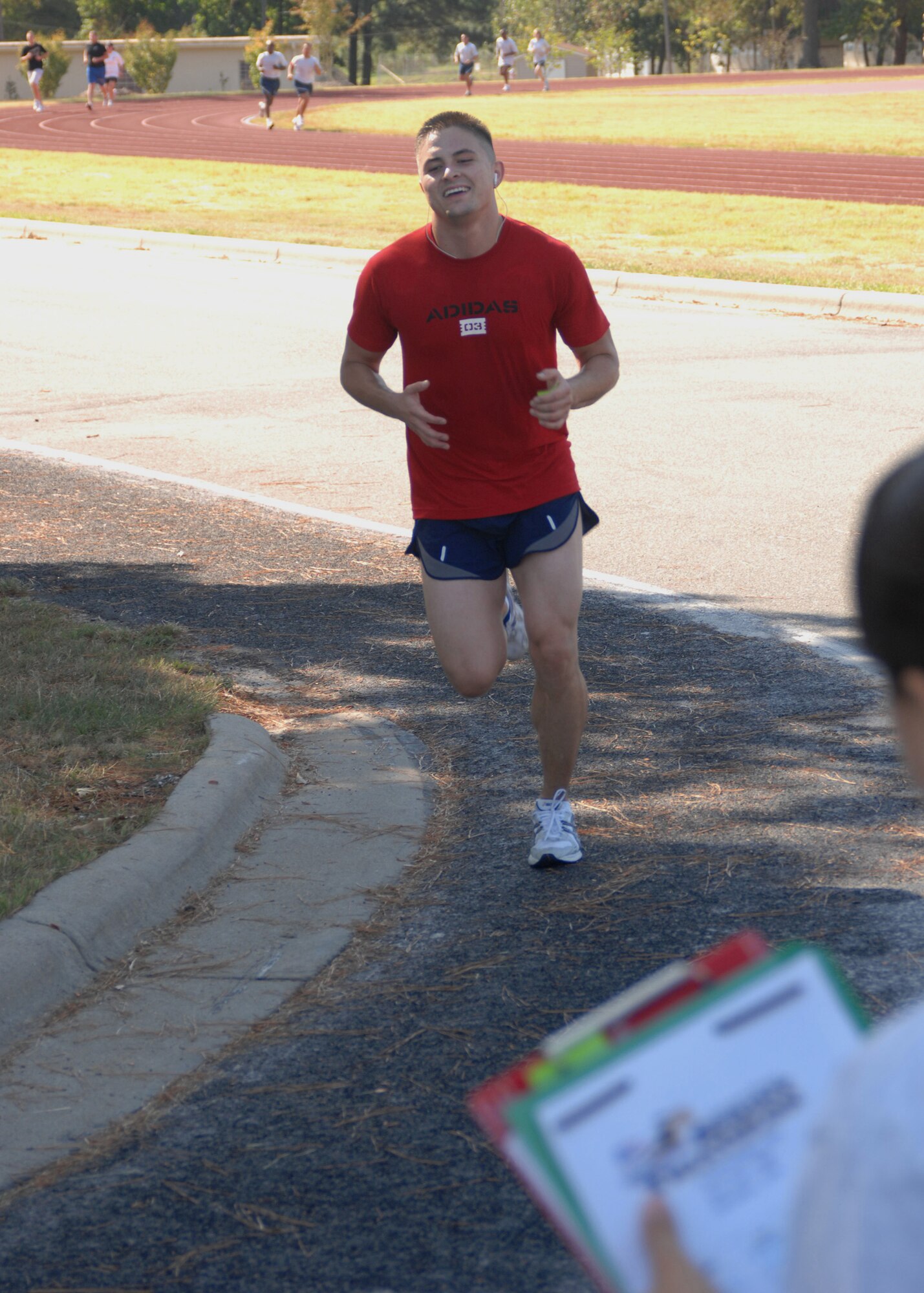 SEYMOUR JOHNSON AIR FORCE BASE - Airman 1st Class Theodore Reynolds finishes up the triathlon race with the running portion.  The race, which consisted of lap swimming, a 15 mile bike ride and a 4 mile run was hosted by the 4th Services Squadron September 8, 2007. (U.S. Air Force photo by Senior Airman Chad Trujillo)