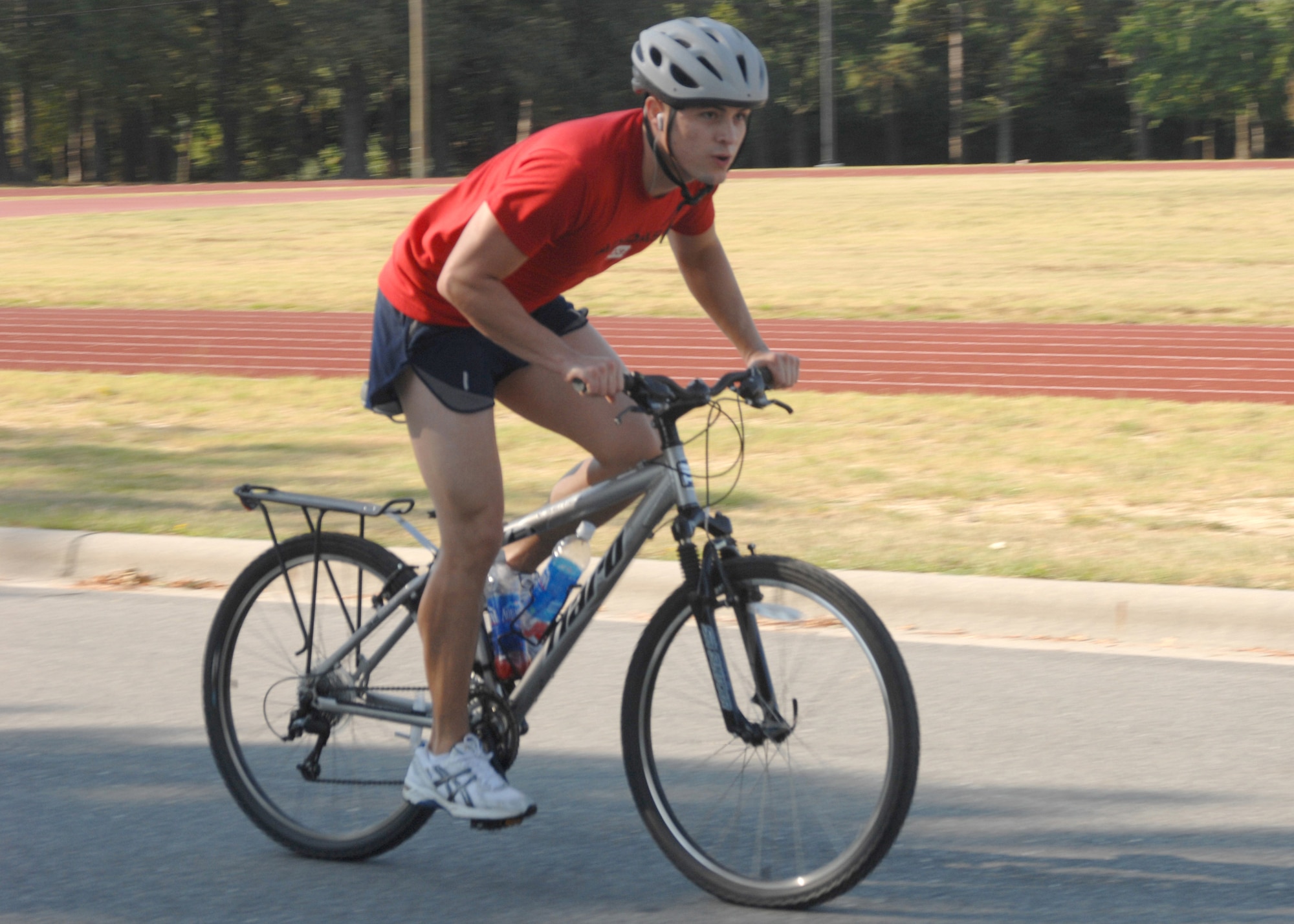 SEYMOUR JOHNSON AIR FORCE BASE, N.C. - Airman 1st Class Theodore Reynolds finishes up the bike portion of the triathlon race.  The race, which consisted of lap swimming, a 15 mile bike ride, and a 4 mile run was hosted by the 4th Services Squadron September 8, 2007. (U.S. Air Force photo by Senior Airman Chad Trujillo)