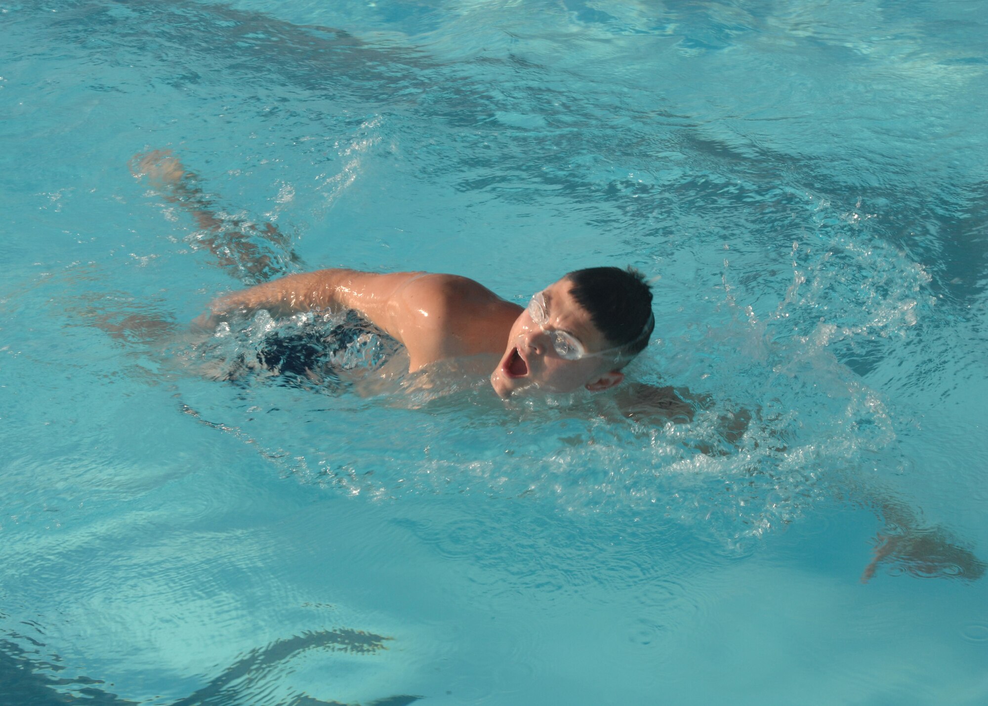 SEYMOUR JOHNSON AIR FORCE BASE, N.C. - Airman 1st Class Theodore Reynolds finishes up the lap swimming portion of a triathlon race.  The race, which consisted of lap swimming, a 15 mile bike ride, and a 4 mile run was hosted by the 4th Services Squadron September 8, 2007. (U.S. Air Force photo by Senior Airman Chad Trujillo)